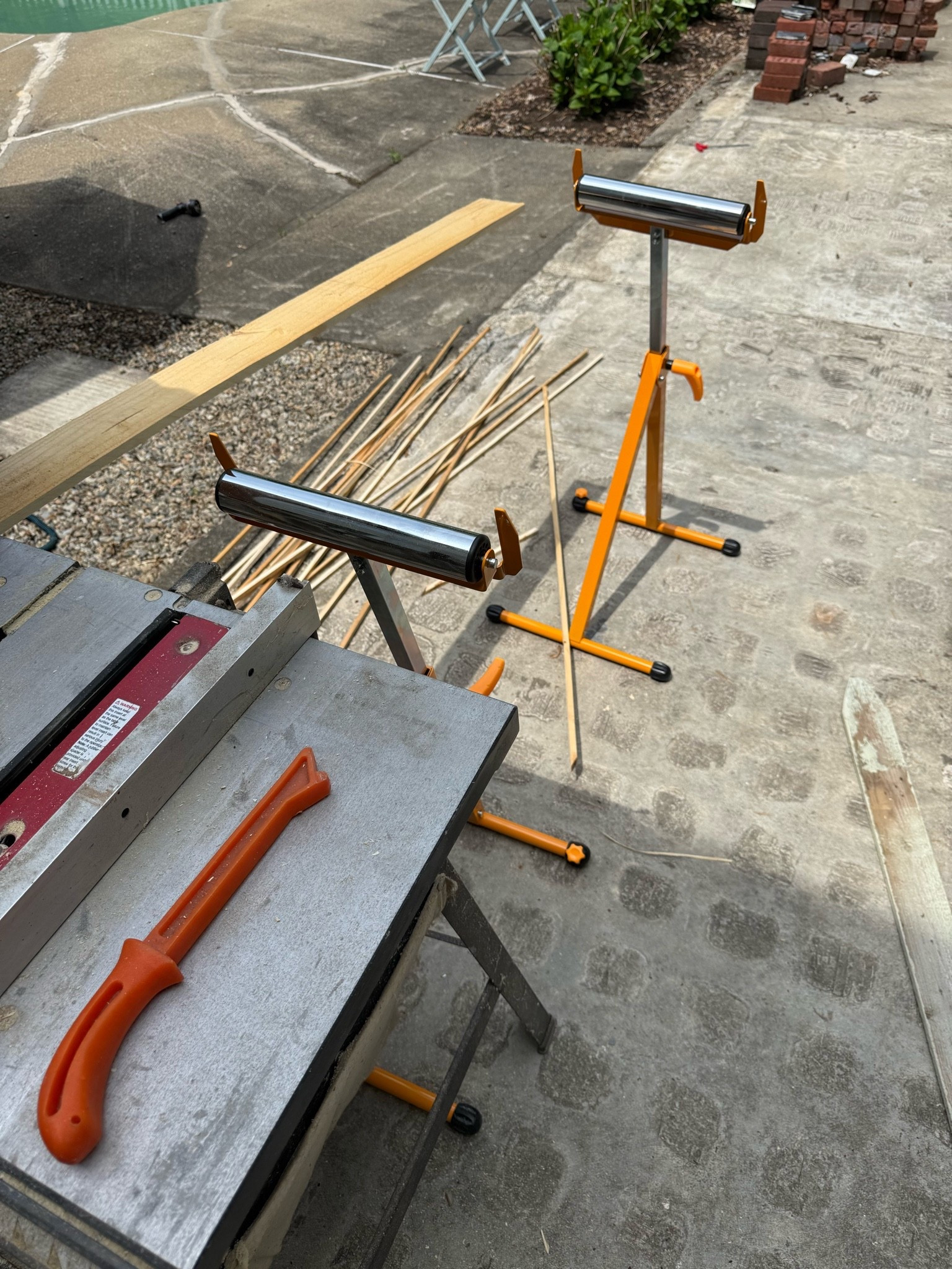 Roller supports for wood going through our miter saw and table saw