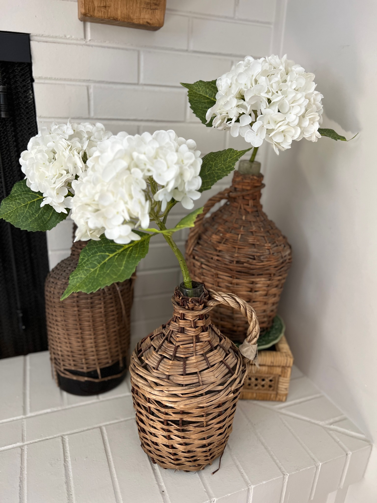 These are the most realistic faux hydrangeas! They are so pretty and go with any type of decor! You can also shop similar wicker demijohns to the ones seen in this picture  

#LTKunder100 #LTKhome #LTKFind