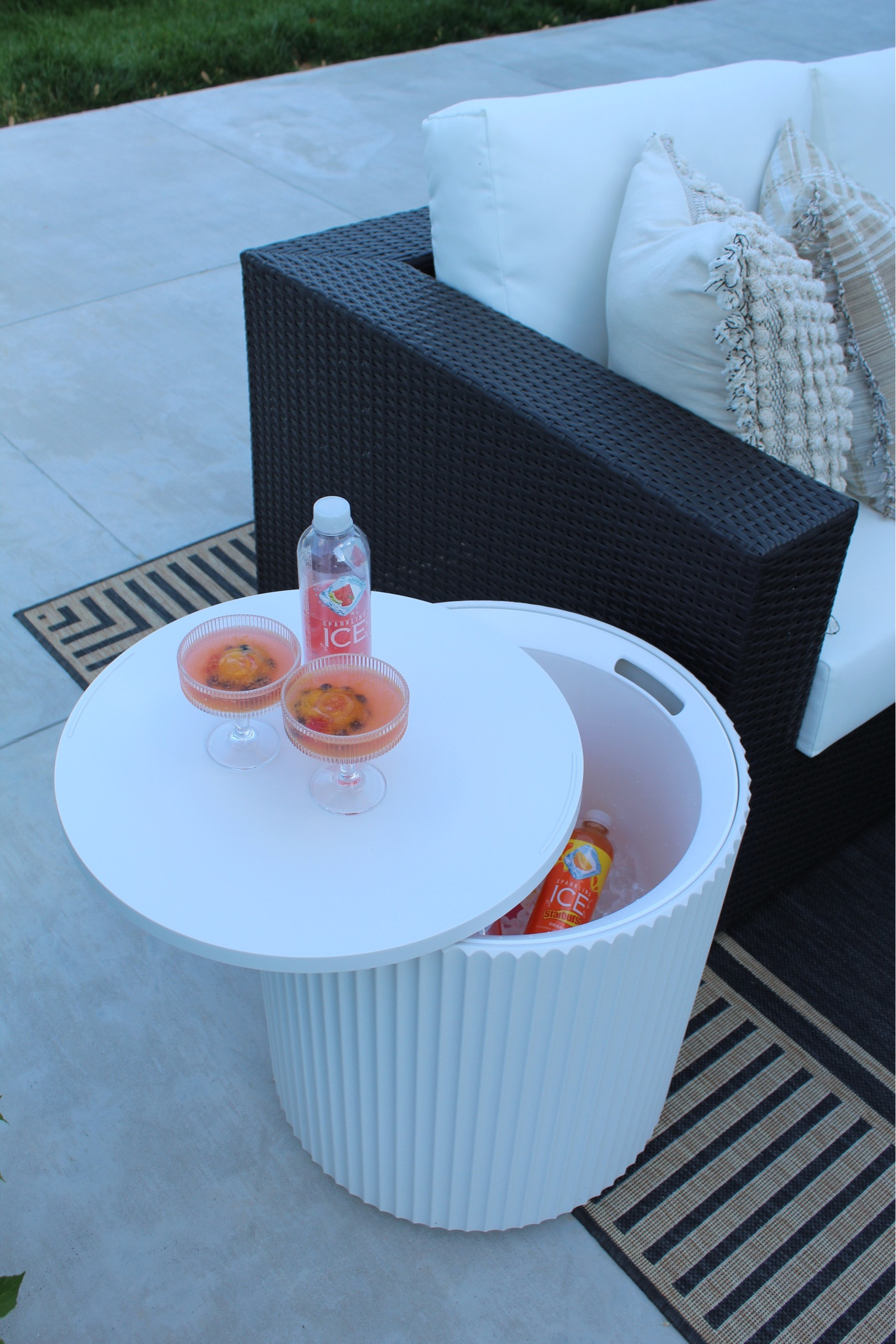 Cooler side table, outdoor rug, outdoor sofa, concrete fire pit, pillows 

#LTKHome #LTKSeasonal #LTKFindsUnder100