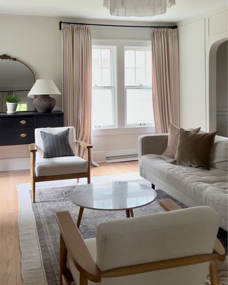 Living room with layered area rugs, two sitting chairs, and neutral home decor. #livingroom #homedecor #arearug

#LTKfamily #LTKhome