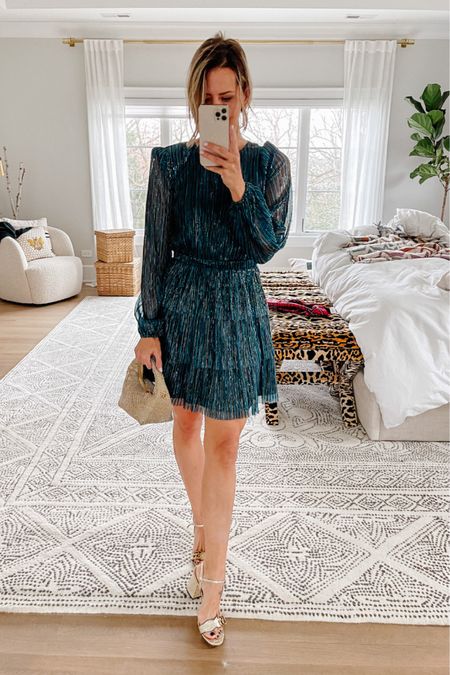 This party dress is the prettiest greenish – blue with a but of sparkle to it! I love the puff shoulders and sheer sleeves. It’s cinched at the waist, which is the style that always fits my body the best. If you’re in between sizes, I would size up. I’m wearing XS.

How cute is this mini rhinestone bag?? It’s less than $80 and you’d never know it. I love this silhouette – it’s perfect for a holiday party or night out.

#LTKHoliday #LTKstyletip #LTKSeasonal
