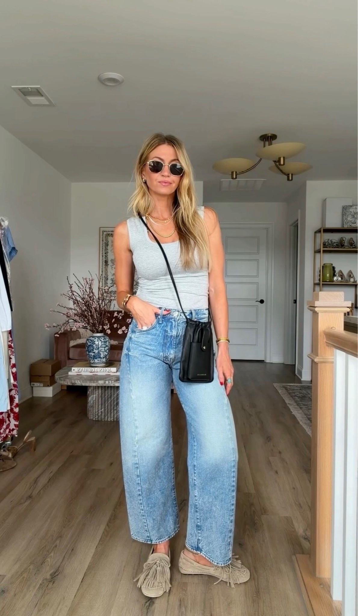 A simple grey tank and jeans styled with some of my jewelry favorites. Heather Gray tank: my Pr Girl white tank now comes in gray! Runs TTS, wearing XS, long length. Mid rinse slightly barrel jeans: TTS, wearing a 25. Pebble gray suede fringe moccasins: TTS, insanely comfortable. Black leather, Crossbody, drawstring pouch, turquoise, ring, metal, lavender perfume, invisible, floating Dorsey diamond necklace.  #LTKootd #LTKgrwm #LTKdayinmylife