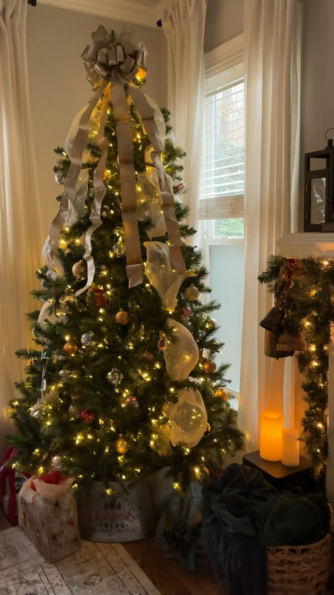 Cozy Christmas vibes are the best! Loving the pops of gold on the Christmas tree and gorgeous garland and gold bells 🔔 

#LTKHome #LTKSeasonal #LTKHoliday