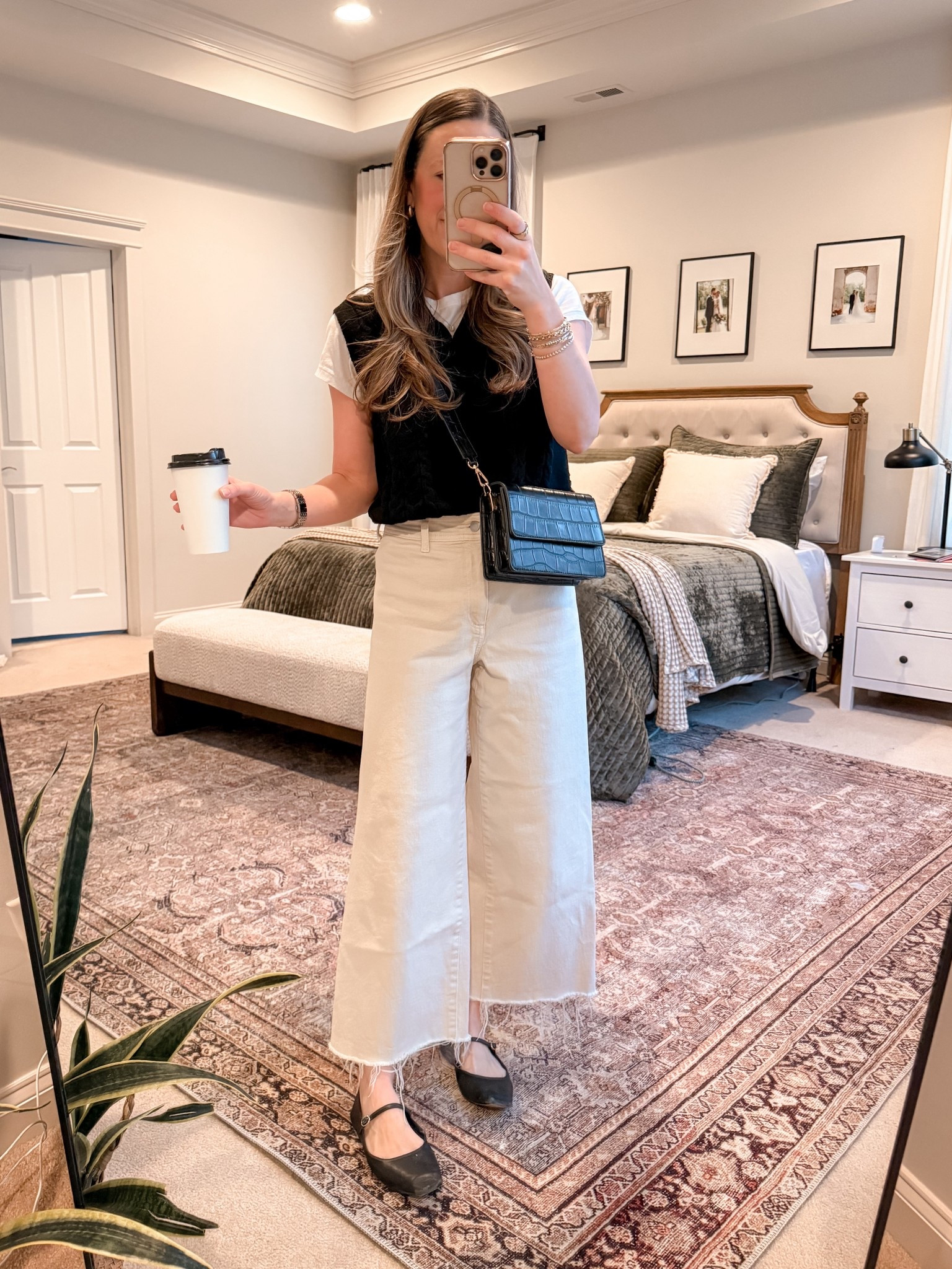 Preppy mom uniform 🤍

Amazon sweater vest layered over a simple white tee + Target’s viral sailor jeans. I’m wearing a 4 in the jeans but should have gone with my true size (2) — they run a little roomy.

Finished it with classic black Mary Janes and a crossbody for hands-free life.

Easy. Polished. Still practical.

#LTKootd #LTKWorkwear #LTKmomlife