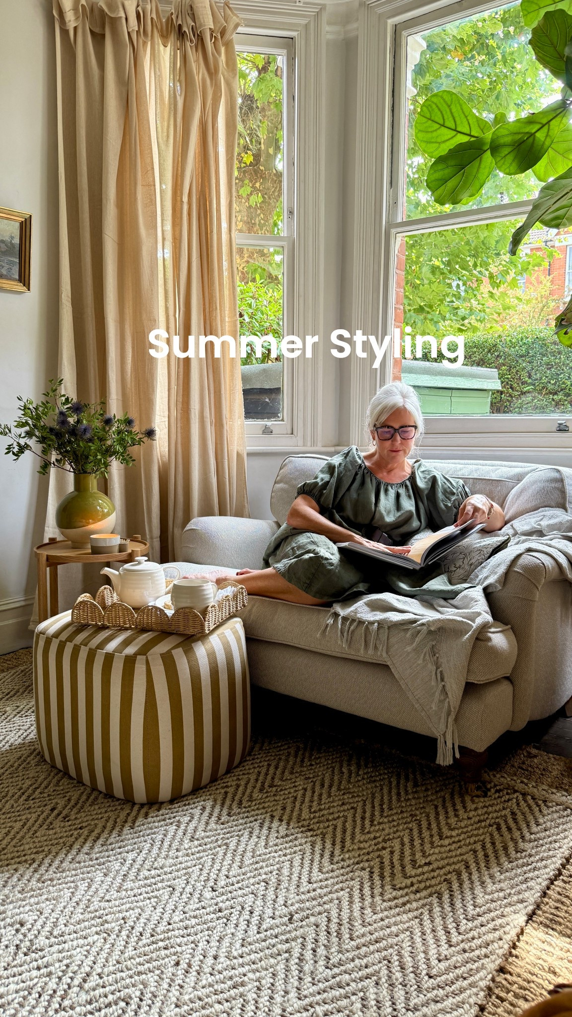 Summer styling doesn’t have to be a big thing. Sometimes it’s just a few small tweaks that change how a space feels.

I swapped out my heavy curtains for gauzy cotton dust sheets that let more light in. Then I added a simple wooden side table, a glazed vase filled with thistles and greenery from the garden, and a patterned cushion and textured throw — all from @habitatuk

And just like that, this little corner feels lighter, calmer, and more inviting. It’s not just about how it looks — it’s about making space to pause. To sit with a cup of tea (biscuits and a book) and take a moment. 