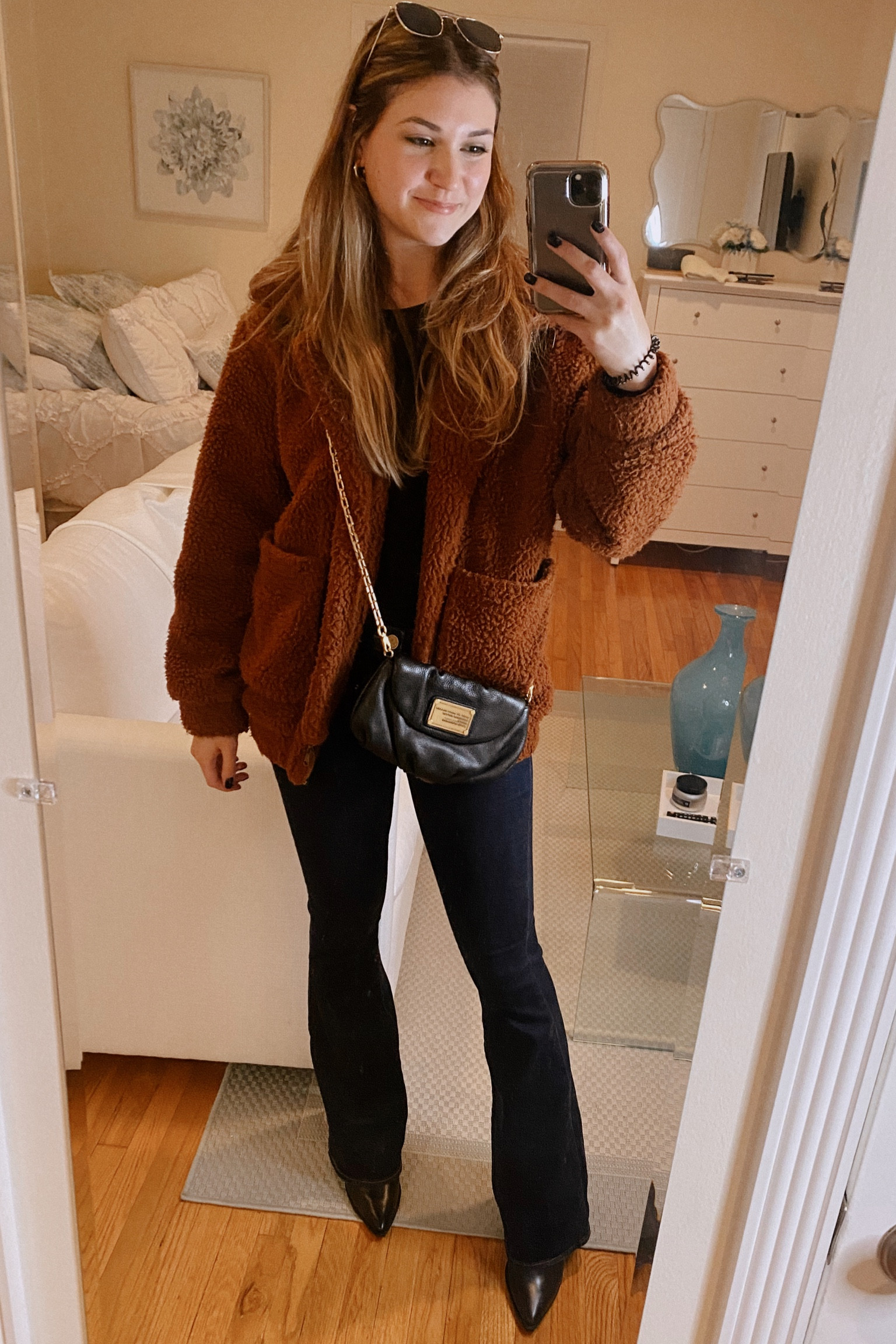 Easy look to recreate! Get a black long sleeve top, flared jeans, pointed booties, and a big furry jacket!! Super stylish with minimal effort!

#LTKSeasonal #LTKU #LTKfit
