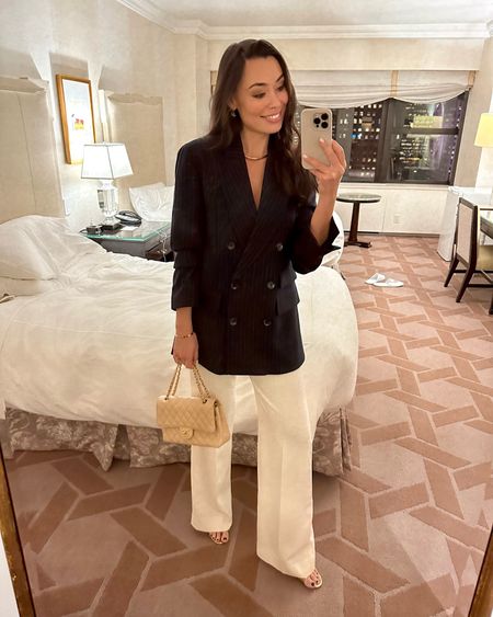 Kat Jamieson wears a navy blue pinstripe blazer, ivory trousers and a Chanel bag to an event in NYC. Workwear, office, holiday outfit, formal, party, cocktail. 

#LTKworkwear #LTKSeasonal #LTKHoliday