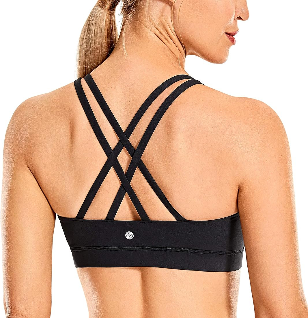 CRZ YOGA Women's Strappy Sports Bras Fitness Workout Padded Yoga Bra Criss Cross Back | Amazon (US)