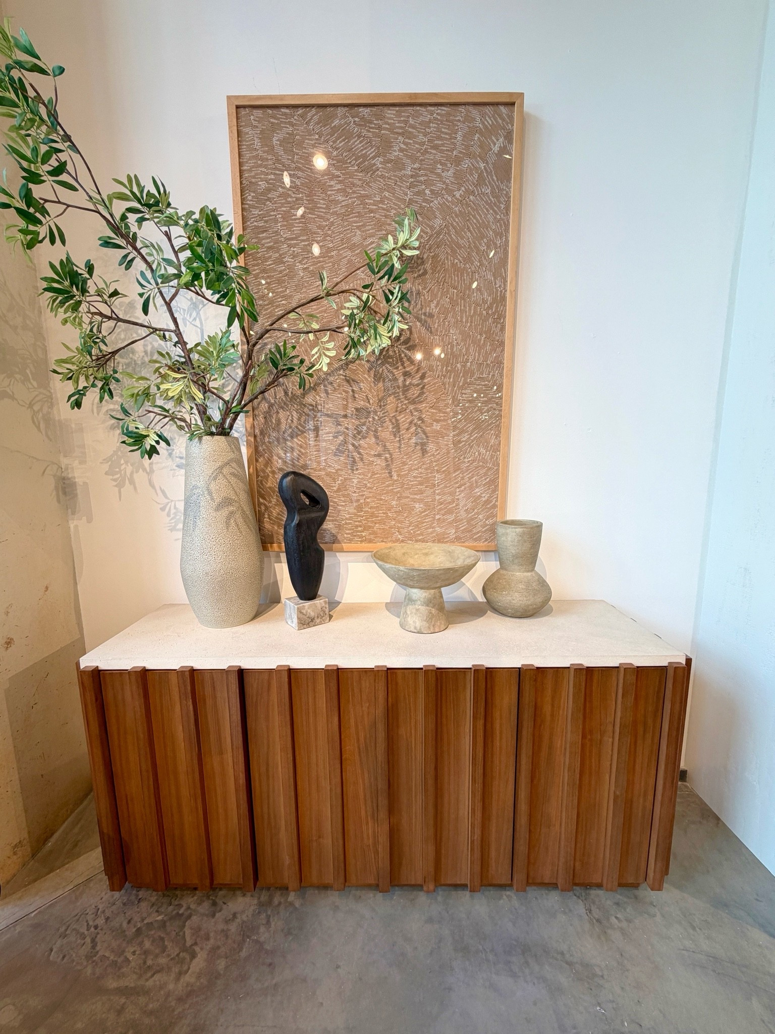 Modern design meets natural warmth! 😍 The Louis Media Console from West Elm pairs a sleek concrete top with beautifully paneled wood for a look that feels both elevated and refined. 🤎 I love the mix of textures—it adds just the right amount of contrast! ✨ Functional, beautifully crafted, and full of hidden storage, it’s one of those pieces you’ll love for years! 🫶🏻 I’ve linked it, along with similar media consoles! @west elm #mediaconsole #sideboard #credenza

#LTKHome #LTKSaleAlert