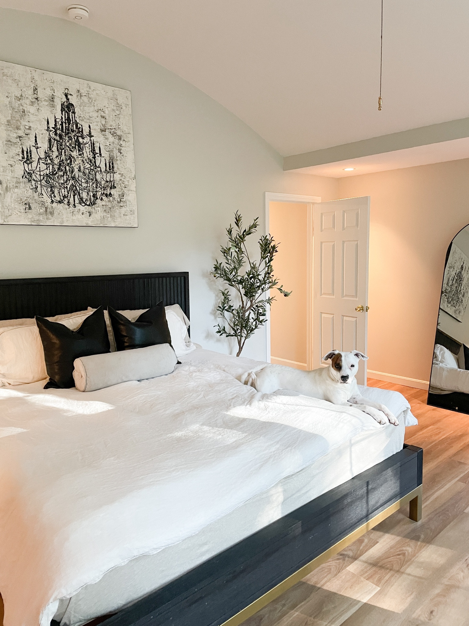 I just moved into my new house and am slowly designing my bedroom space! I’ve linked a similar wood king bed, duvet, throw blanket, pillows, canvas artwork, olive tree, full length floor mirror, and some accent pieces! 

#LTKHome