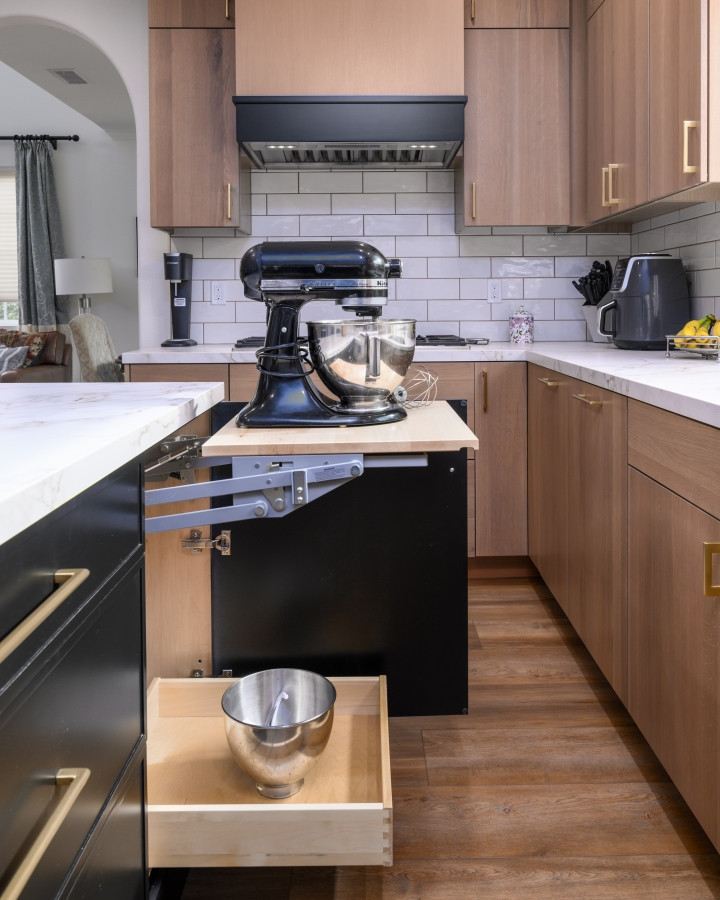 This is what we mean when we say “designed for real life.” In this recent kitchen remodel, we not only designed and remodeled the entire space—we also supplied this custom cabinet with a built-in mixer lift. Tucked into the black island cabinetry, this hardworking feature makes it easy to access and store your stand mixer with zero heavy lifting. Bonus: the drawer below is perfect for extra bowls or attachments.

Form meets function in every cabinet we design—because your kitchen should work as beautifully as it looks.

#KitchenRemodel #ApplianceStorage #MixerLiftCabinet #CustomCabinetry #DesignBuildFirm #LTKHome #PinterestKitchen #FunctionalKitchenDesign #KitchenIslandStorage #BakingStationGoals #WhiteOakCabinets #SmartKitchenSolutions #ModernKitchenInspo #InteriorDesignDetails #CabinetryThatWorks 

 #LTKHome