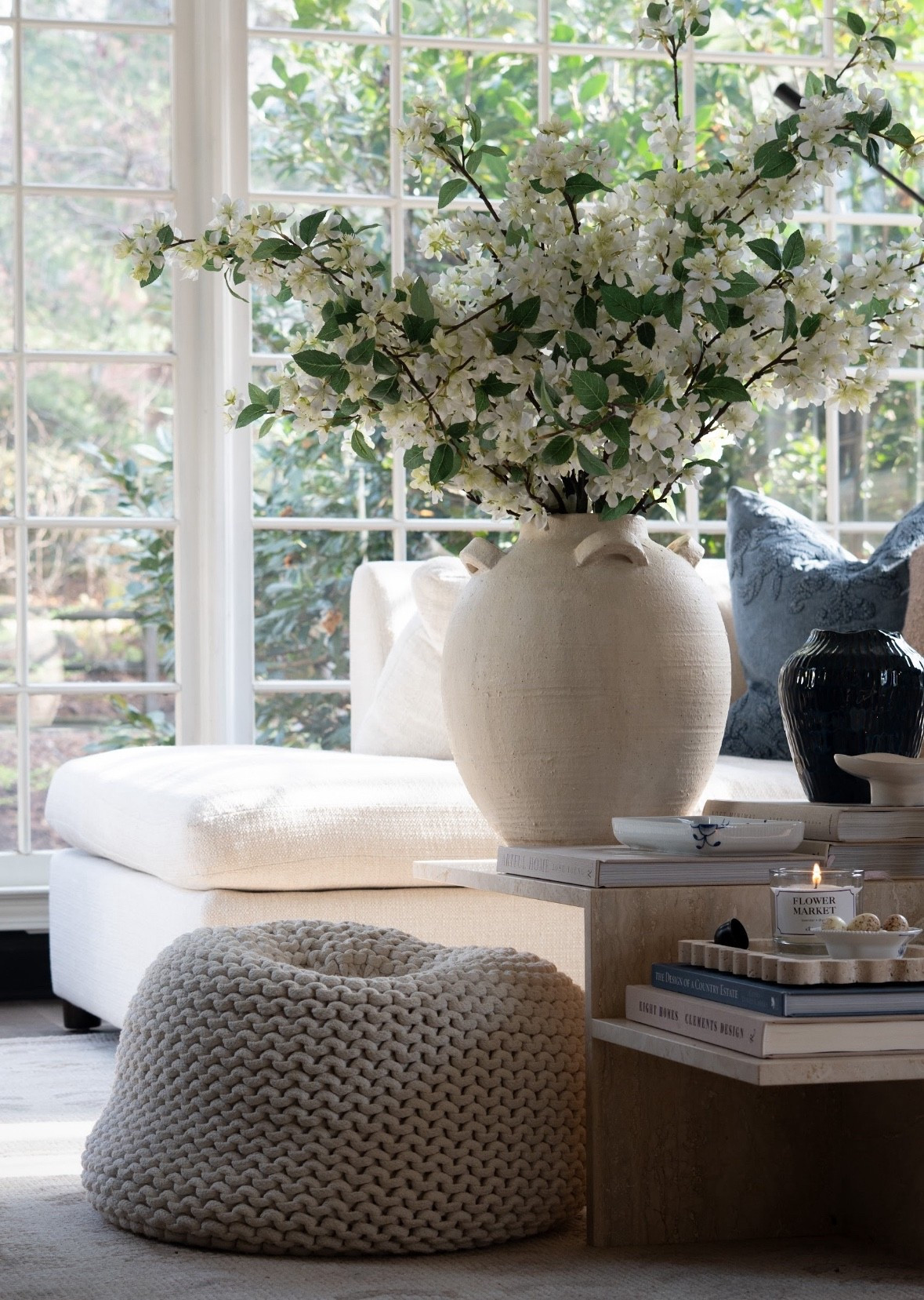 You guys… I cannot get over this space. The fresh spring branches, layered coffee table styling, design books, and cozy neutral textures are giving the most perfect calm living room vibe. Add the natural light and subtle blue accents and I’m officially obsessed.

#LTKSpringSale #LTKHome #LTKSeasonal