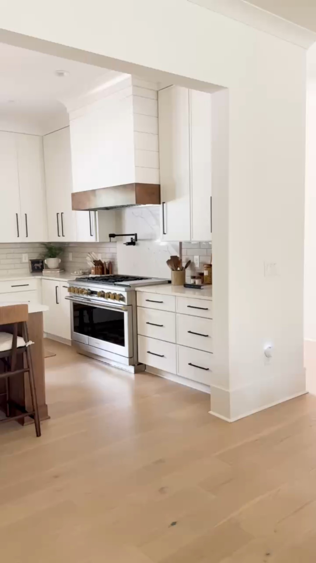 Airy, timeless, and beautifully balanced — this open-concept kitchen blends classic white with warm wood tones and natural light for the perfect modern farmhouse feel. Designed for everyday living with elevated ease. 🍽️☀️ #ModernClassic #TransitionalKitchen #WhiteAndWood #ModernFarmhouseStyle #LTKHome #porcheandco

#LTKStyleTip