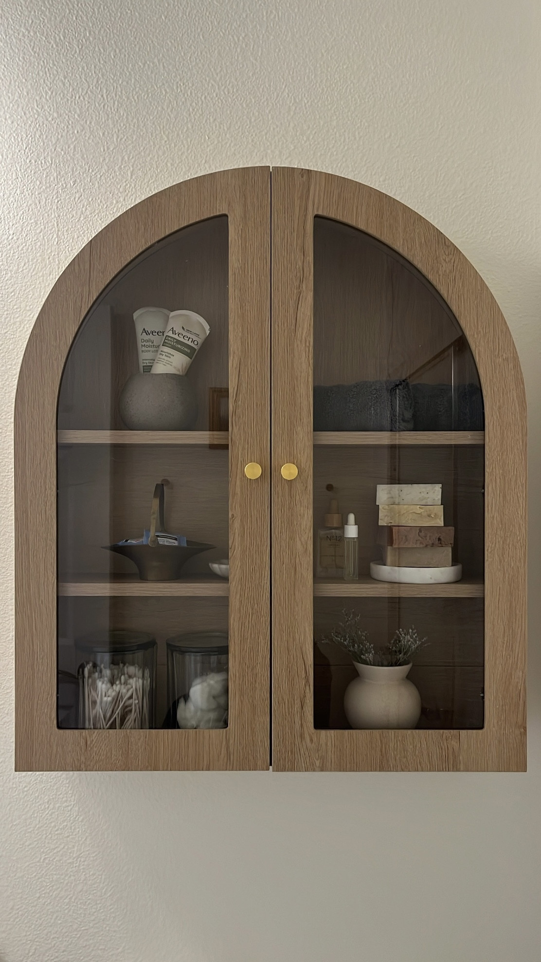 I love having a glass wall cabinet so that guests are able to see things at a quick glance. 

#LTKHome