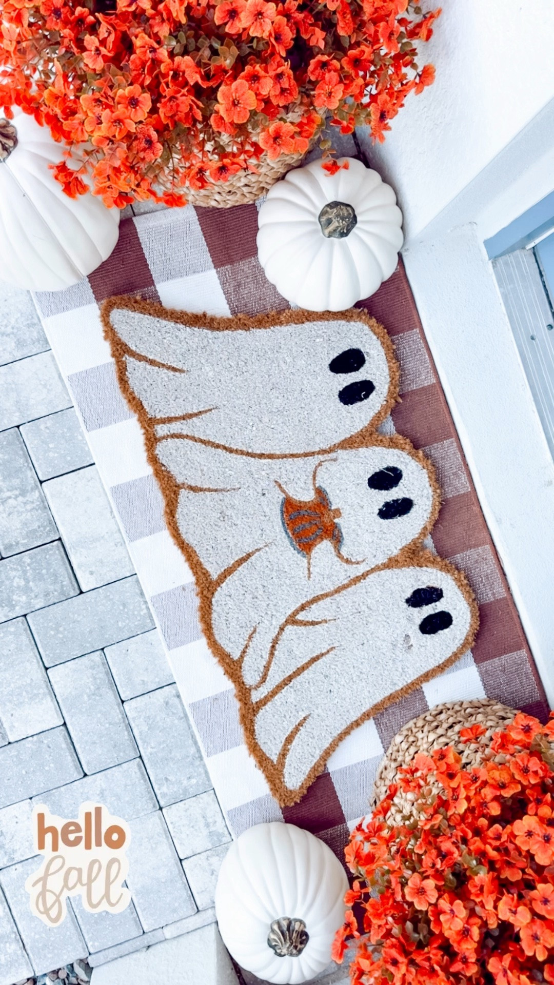 Fall Porch + Fall Patio Decor - Artificial Mums styled in a woven basket with artificial white pumpkins, a brown plaid mat, seasonal fall / Halloween welcome mat, + a cream pampas wreath for the front door. The fake pumpkins come as orange pumpkins in various sizes too. The artificial mums also come in a variety of fall colors. This only took me a few minutes to put together and decorate our front porch/ patio. I arranged the mums into the styrofoam and then placed each set in a basket. This is an easy + cozy way to decorate your home for fall!

#LTKHome #LTKSeasonal #LTKSaleAlert