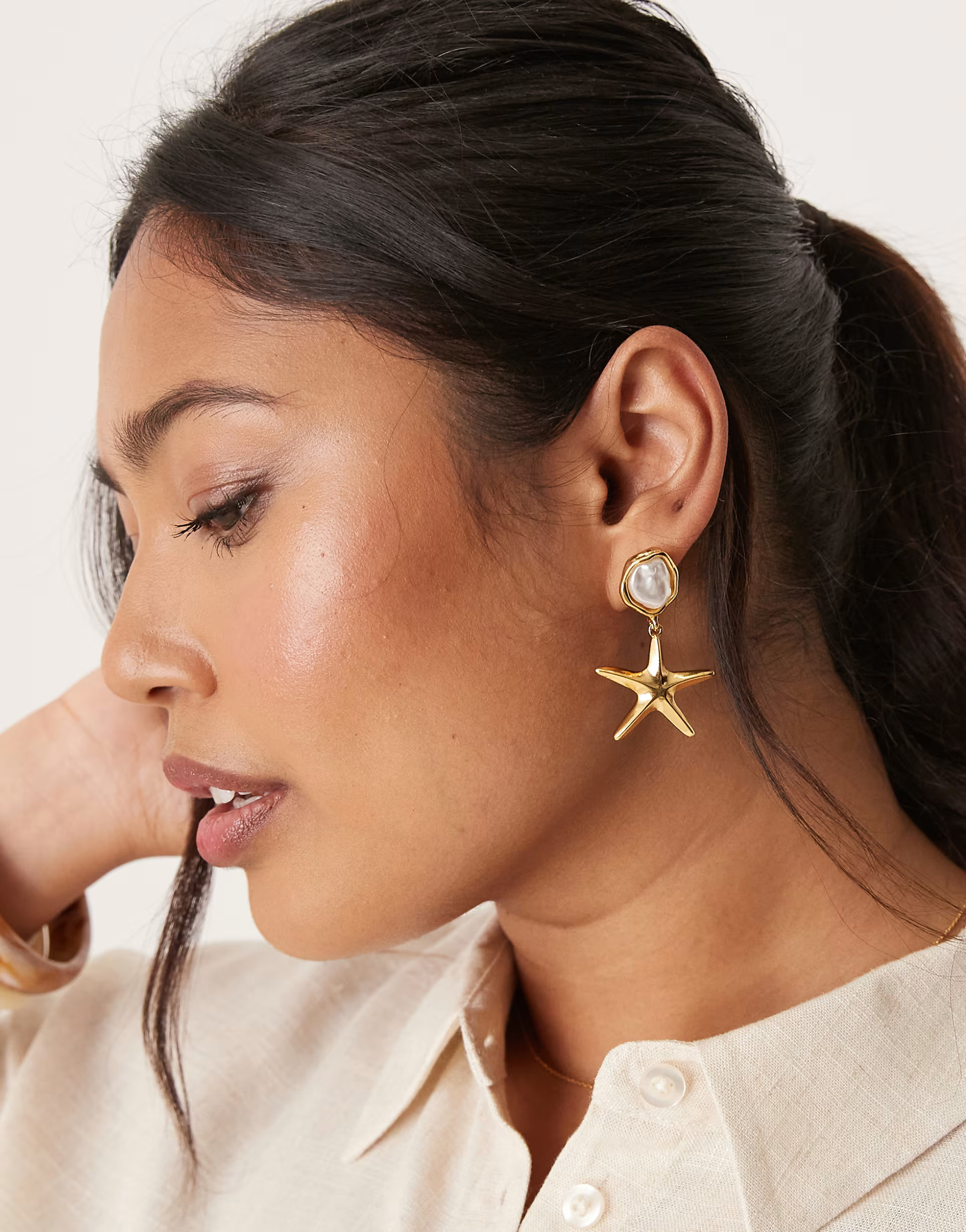 Orelia gold plated stud and starfish drop earrings in pale gold | ASOS (Global)