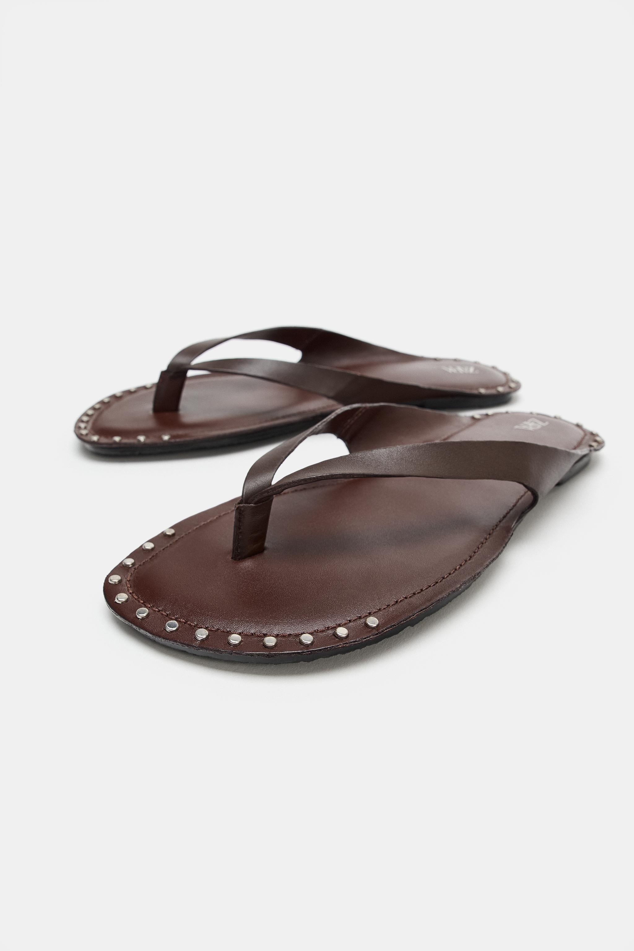 Model height: 181 cmFlat leather sandals. Studded trim. Toe post strap. Round toe.Sole height: 1 ... | Zara UK