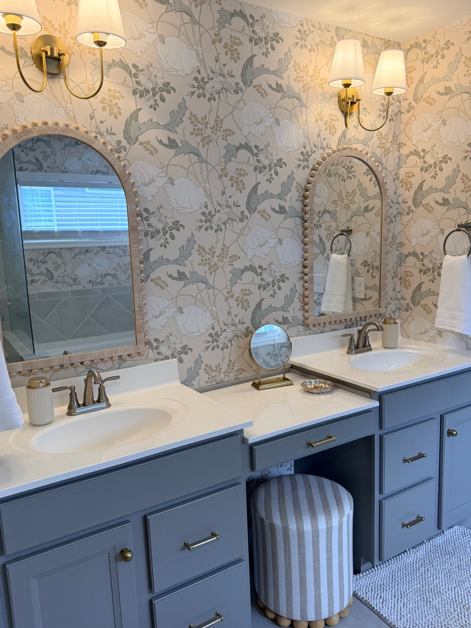 Master bathroom, Amazon sconce lighting, bathroom lighting, striped ottoman, Walmart soap pump, arched ball mirror

#LTKHome #LTKSaleAlert