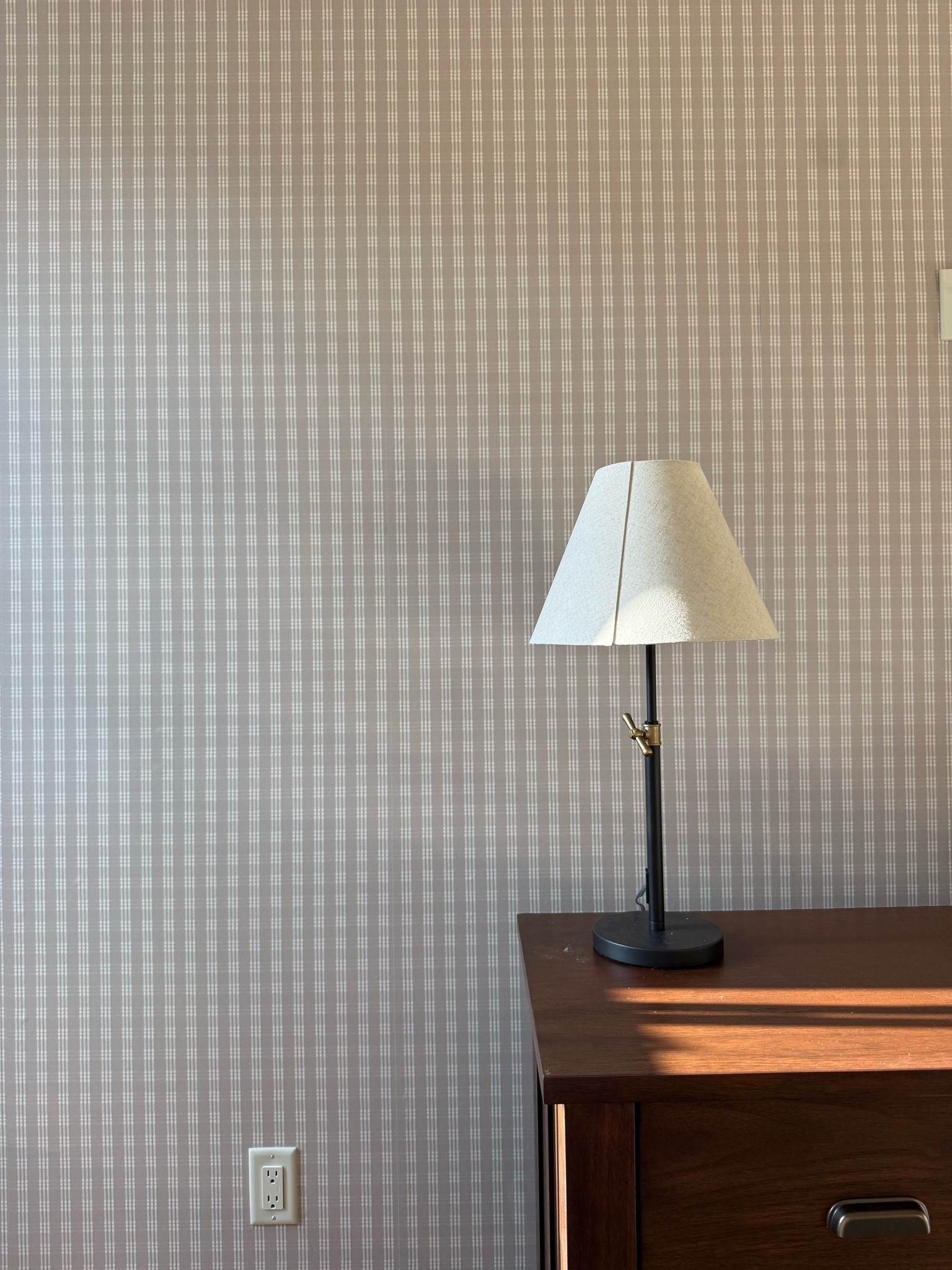 Wallpaper from Love vs Design 
Ours is 
Retro Check Wallpaper
Colors
Shell, Dove
Woven Peel & Stick