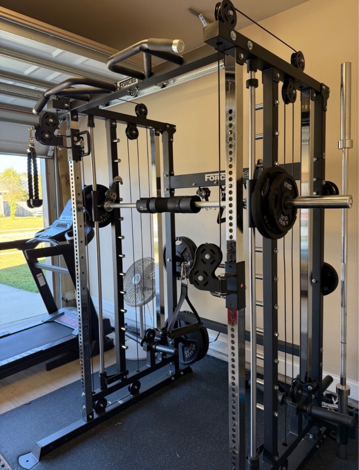 The brand of mine is Force USA but can’t link it so liked one similar to it that’s in prime week sale! It’s just like the one I have but the one on Amazon comes with the plates! I had to purchase mine separately! I’ve had this for a year now and workout in my garage and I love it! I’m able to do everything I did in the gym! I was worried I would lose my results not being in a gym anymore but not the case at all! Highly recommend!! Linked the mats that ours is sitting on! #allinonetrainer #workoutequipment #homegym