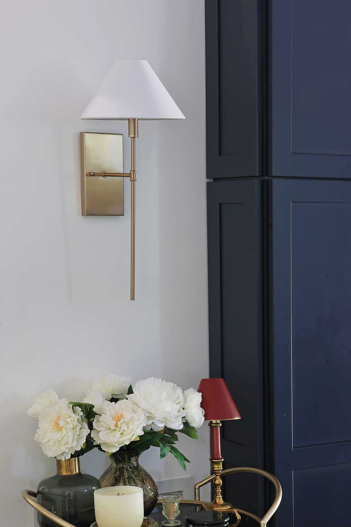 A brass wall sconce with an empire shade is a classy touch to light up any wall.   

 #LTKHome