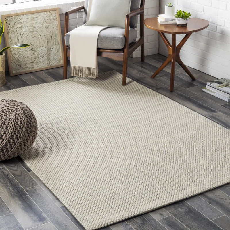 Lowe Handmade Hand Woven Wool Cream Rug | Wayfair North America