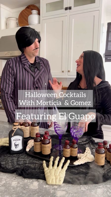 It’s cocktail time with Morticia and Gomez Addams!! Today they whipped up some Spicy Spellbound Martinis using Fuego Bitters from @elguapobitters the Fuego Bitters are Gomez’s favorite! El Guapo’s bitters, syrups and mixers take your cocktail to a whole new level! With premium ingredients, you’ll never have a cocktail without El Guapo again! Use code: JORDANF for 20% off site-wide!  
Recipe: 

• 2 oz Gin or Vodka (we ♥️ 13th Colony)
• .5 oz dry vermouth 
• 2 spoon-fulls black olive juice
• 6 dashes El Guapo® Fuego Bitters
• Habanero if you’re brave… (sub bell pepper if you’re not) for garnish

Slice top off your pepper of choice. Place pepper tip side up into a clean martini glass. In a clean shaker filled with ice, combine spirit of choice with vermouth, olive juice and bitters. Shake until well chilled and carefully strain into martini glass, being sure to hold tip of pepper with your finger to keep it upright in the glass. Serve martini immediately. #elguapobitters

#LTKSeasonal #LTKHalloween