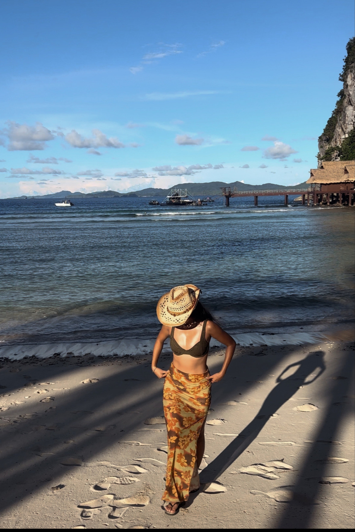 The perfect outfit that seamlessly transitions from a laid-back beach day to a sunset beach club party. Pair a bikini top with a maxi skirt for an effortless, put-together vibe. For that beach goddess meets coastal cool look, top off your vacation beach outfit with a cowboy hat and a freshwater pearl choker necklace.
 