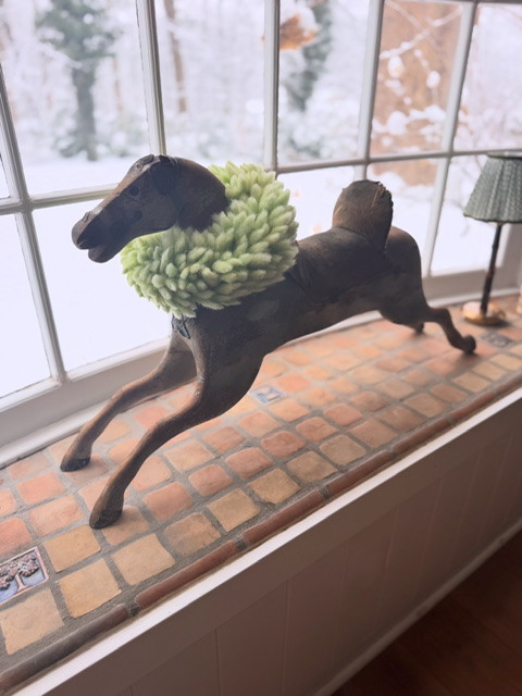 This fuzzy bunny tail wreath will be making appearances for St. Pat's and Easter, but right now, it's keeping our wooden horse warm in the snow. 

 #LTKSeasonal #LTKHome