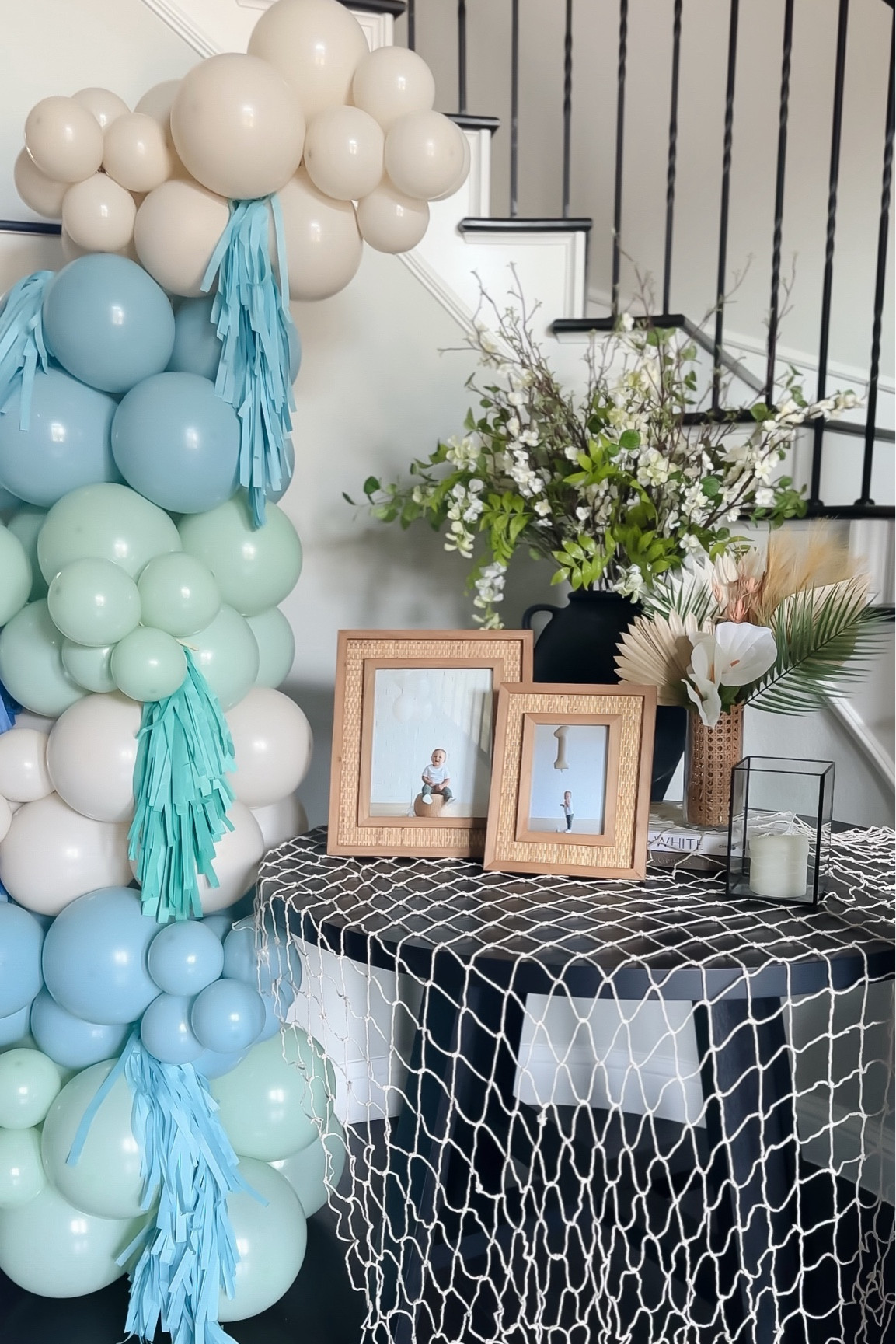 Entryway decor for Jackson’s first birthday party! We framed his 1 year pictures, added palms and florals, draped a fishnet and added freestanding balloons! 

#LTKFamily #LTKParties #LTKKids
