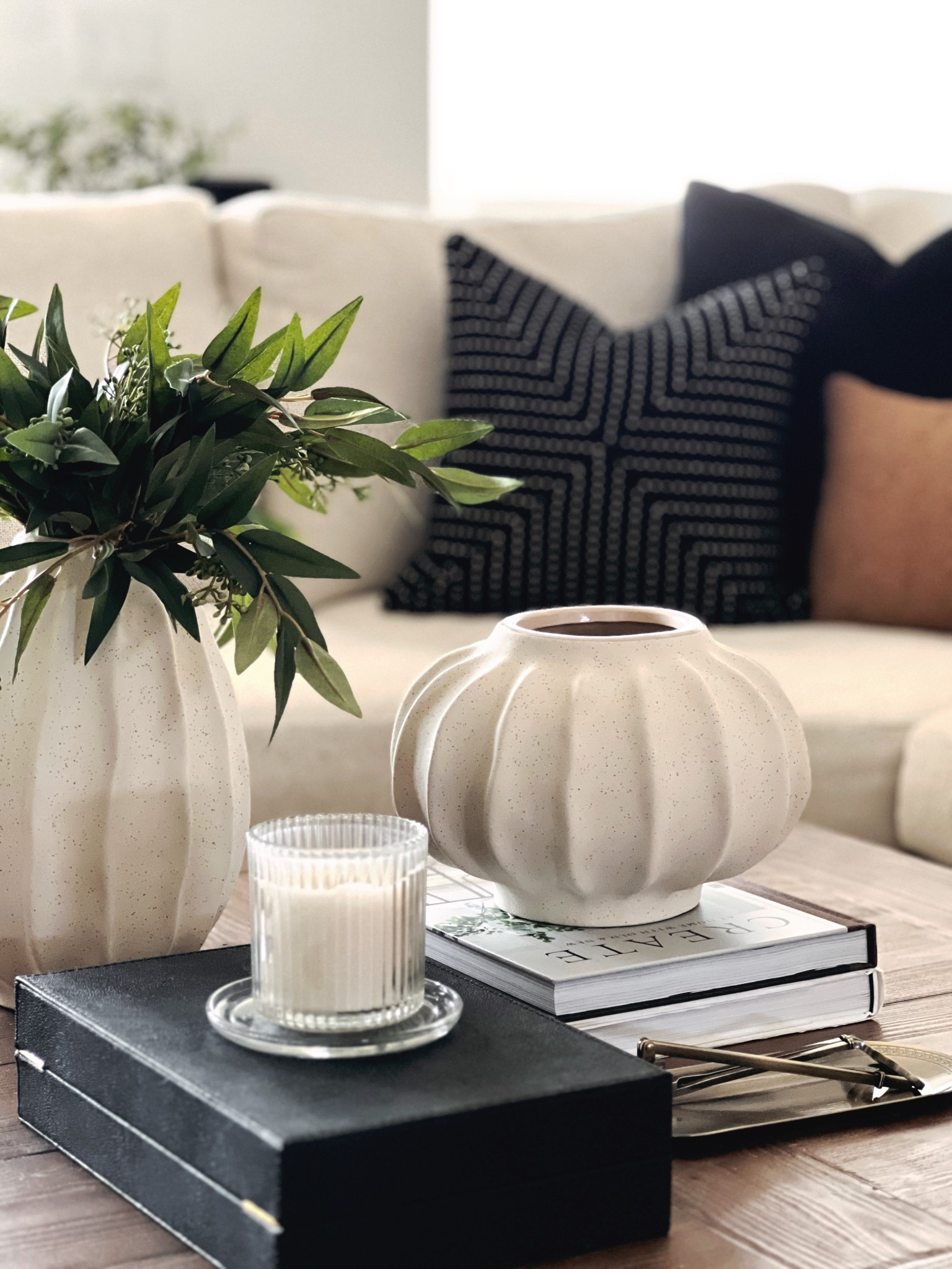 Vases make any coffee table look easily styled and high end! Base styling, coffee, table decor, large square wood coffee table, scalloped edged vases, scallop vases, coffee table books, black-and-white decor

#LTKHome