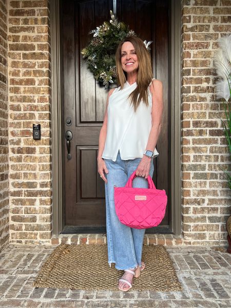 Here's a fun spring transition outfit. These wide leg jeans are must-haves that I plan to wear all spring and summer. I paired it with a sleeveless white top for an easy breezy look. Accessories are this fun hot pink bag for a pop of color and crystal heels for a fun touch.
#casuallook #outfitinspo #midlifestyle #springfashion

#LTKitbag #LTKstyletip #LTKSeasonal