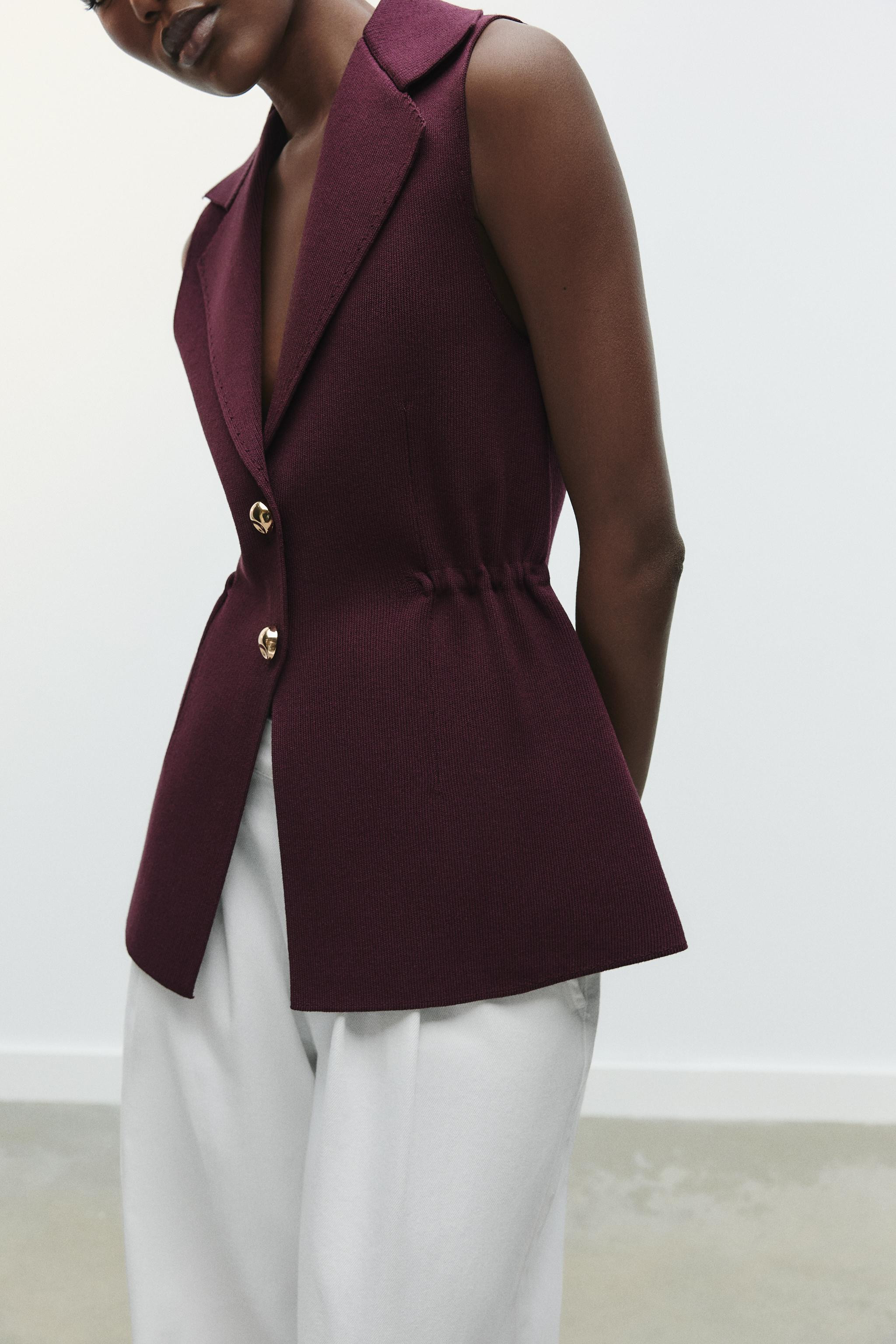 Plain knit waistcoat with a lapel collar and sleeveless design. Featuring elasticated gathers at ... | Zara UK