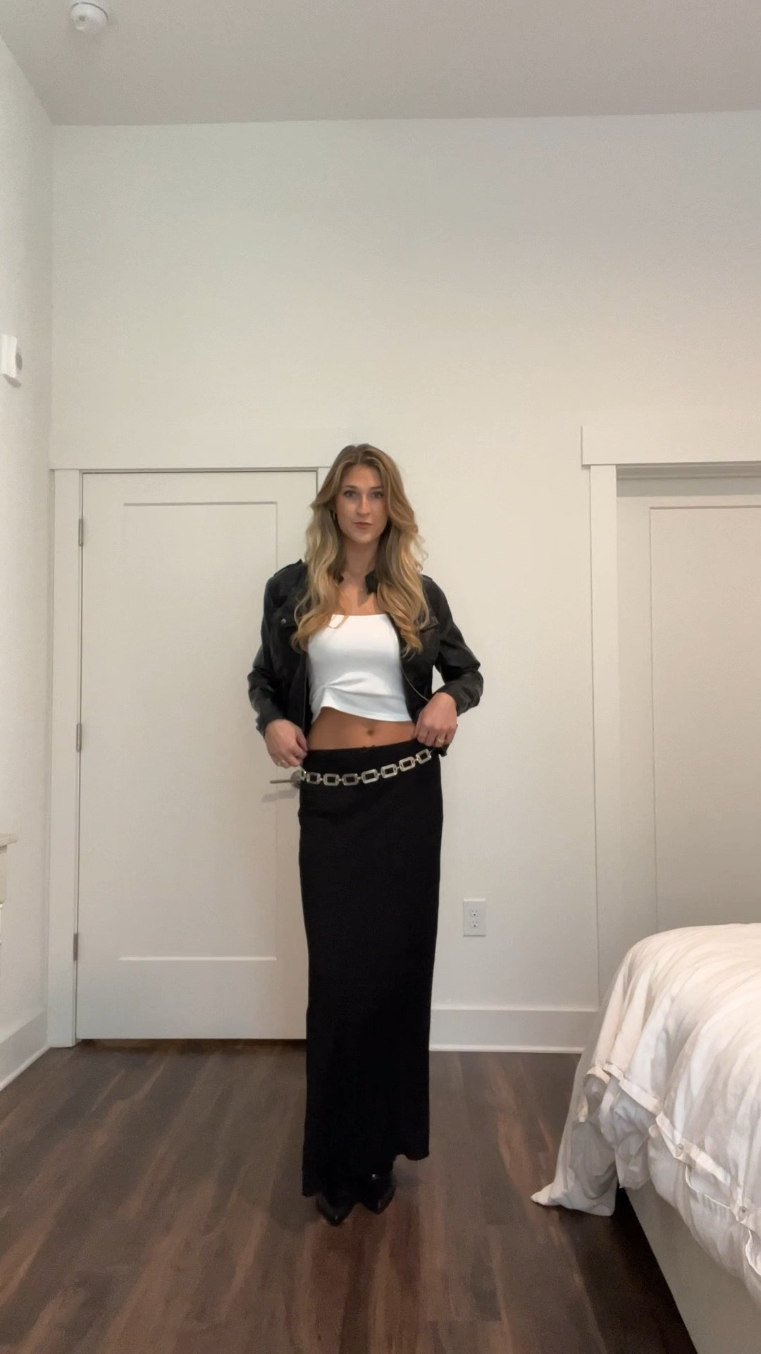 black moto motorcycle leather jacket, white basic tank top, low rise black maxi skirt, fold over black boots, silver chain belt

#LTKshoecrush #LTKfindsunder100 #LTKfindsunder50