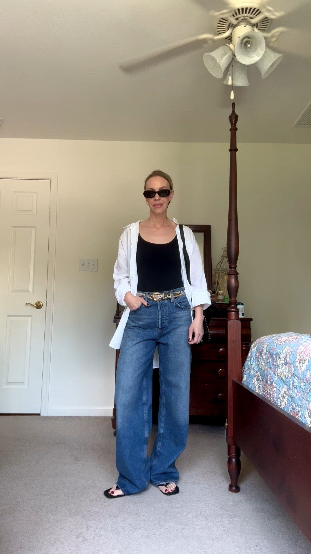Transitional outfit summer to fall with oversized linen shirt, baggy wide leg jeans, thong sandals