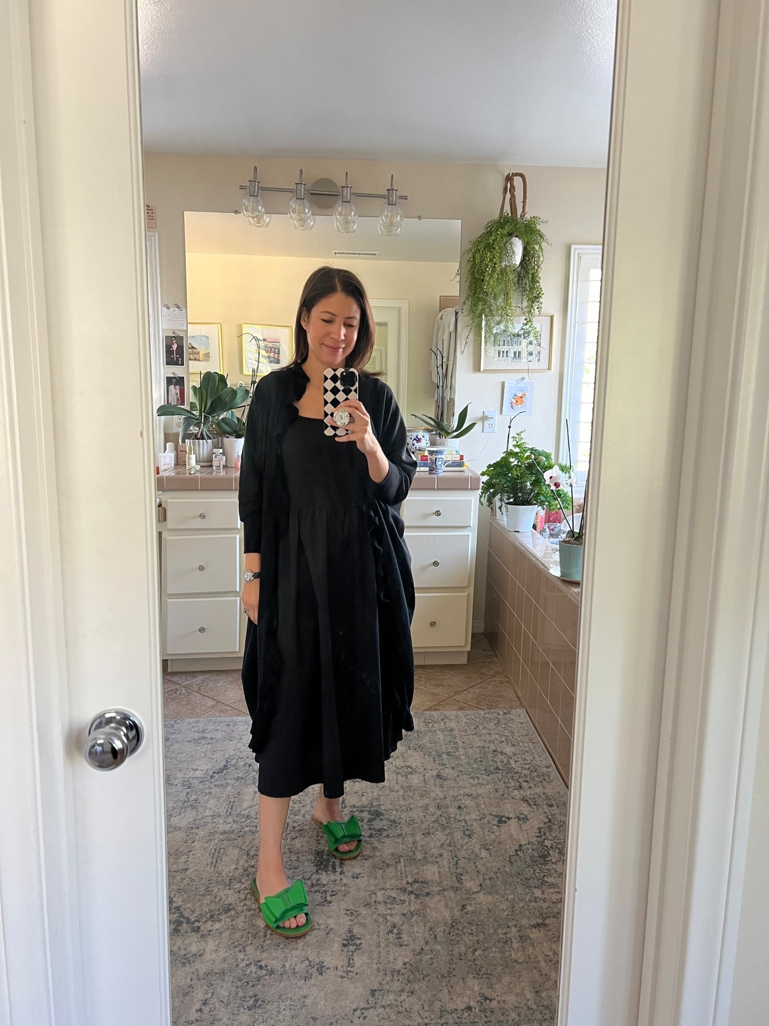 Here is a lovely alternative to the classic pashmina: the Mersea Charleston Ruffle Kimono. It’s such a graceful piece, with soft ruffles that add movement and romance to any dressy occasion.

I’m wearing it over my simple Quince Cotton Mixed Media Tank Dress in black. I adore how the kimono instantly elevates a minimalist silhouette. It brings that touch of drama without feeling heavy or fussy— perfect for dinners, gatherings, or special evenings out.

On my feet, I’m wearing my Jon Josef sandals (I’m not certain they’re still available, but any elegant, minimal sandal would work beautifully here).

This look feels refined yet effortless exactly what I strive for in my ten-item wardrobe. Sometimes all you need is one statement layer to transform a simple dress into something memorable.

Are you a pashmina devotee, or would you try a ruffle kimono instead?

Keep calm and remain classy. ✨

#FrenchInspiredStyle
#TenItemWardrobe
#EffortlessElegance

#LTKOver40 #LTKgrwm #LTKSeasonal