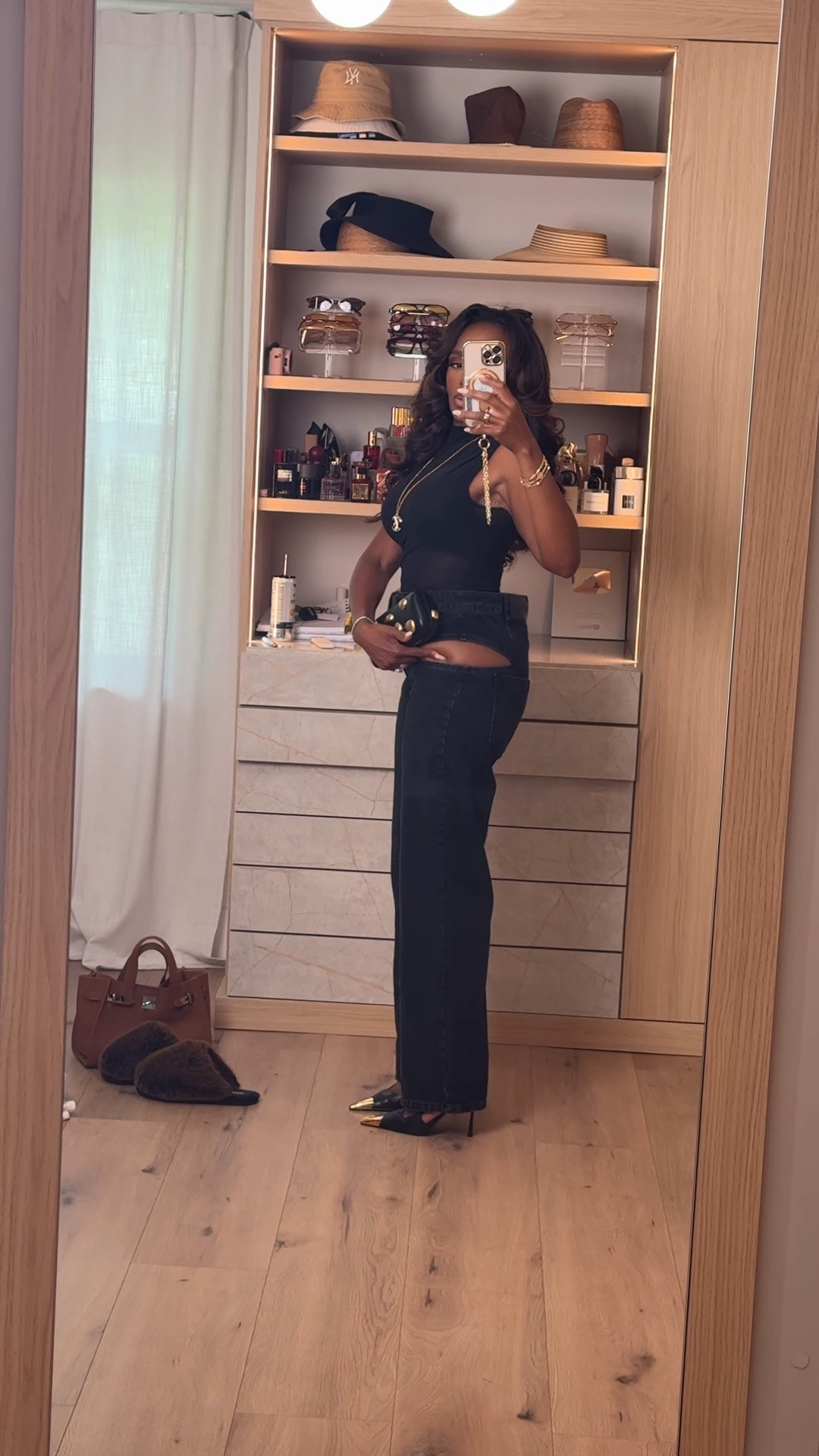 Hi Babes! 🖤✨

This all-black look is giving effortless glam with a little edge. The cutout denim, sleek bodysuit, and gold accessories make this the perfect outfit when you want to make a statement without doing too much.

✨ Fit Details:
• Black sleeveless bodysuit
• High-waisted cutout wide-leg jeans
• Pointed-toe heels
• Gold statement accessories
• Structured black clutch

🖤 Where To Wear:
• Date night
• Concerts
• Girls’ night out
• Dinner with friends
• Rooftop cocktails

✨ Style Tip:
Gold accessories instantly elevate an all-black outfit and make it look expensive and polished.

Everything is linked below!

xx Kira | IG: KirasFashionFinds

📏 Measurements: 5'4" | 140 lbs | 34D Bust | 27" Waist | 40" Hips