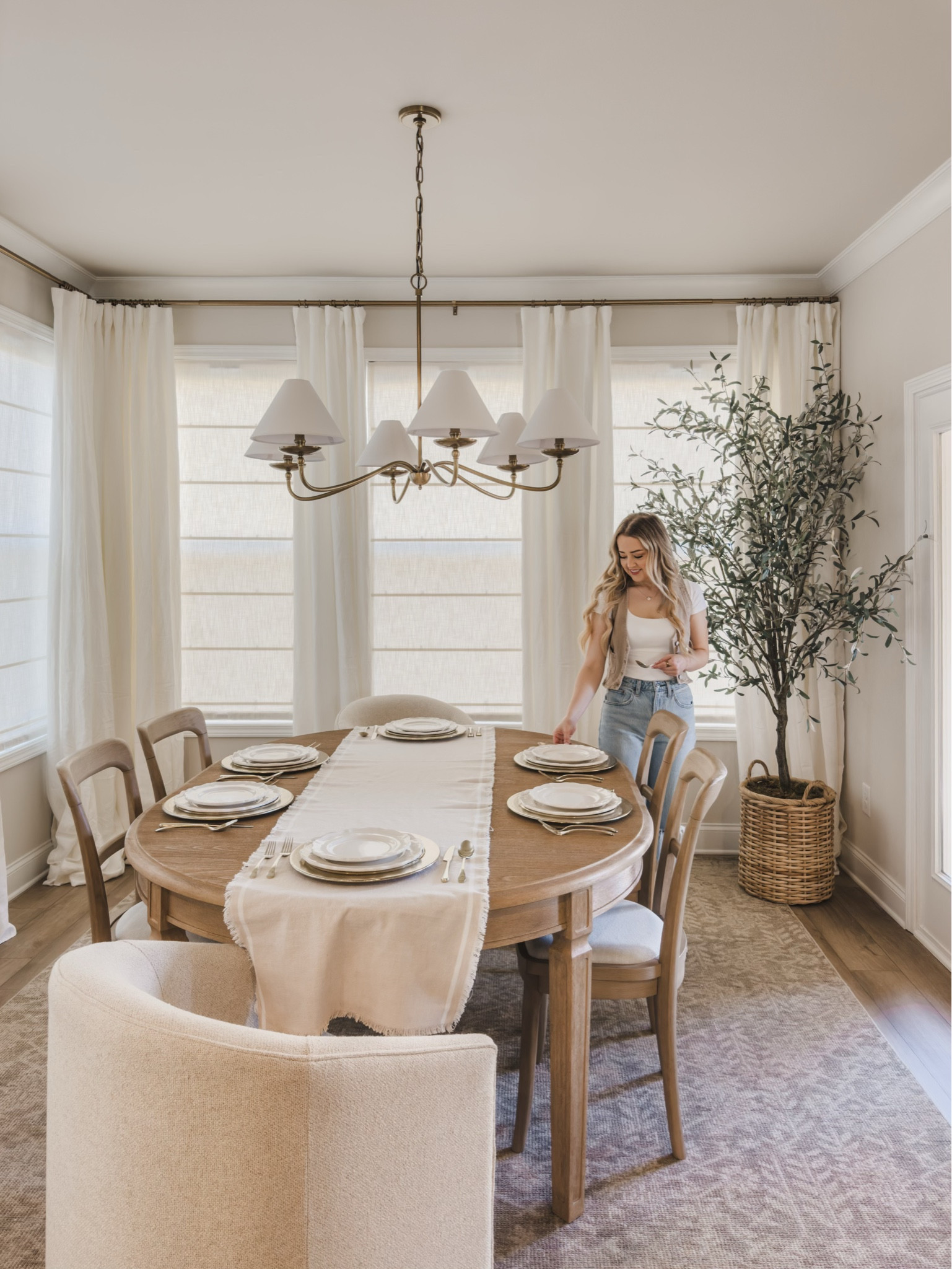 Setting the table for Thanksgiving with Pottery Barn! From elegant serveware to thoughtful details, Pottery Barn helps elevate every moment - especially for the holidays. I love mixing the timeless Heirloom Collection with the classic style and charm of the Rustic Metal Collection — it's the perfect blend of classic and cozy. To add a festive touch, I added pops of seasonal color along with some fun turkey place card holders!

Home style, neutral home inspo, Thanksgiving table, charger plate, table runner, neutral wood tones, furniture favorites, faux tree, gold detail, lighting detail, Pottery Barn style, neutral area rug, linen curtain, linen shades, light and bright, holiday home style, holiday hosting, gold silverware, shop the look!

#LTKSeasonal #LTKHoliday #LTKHome