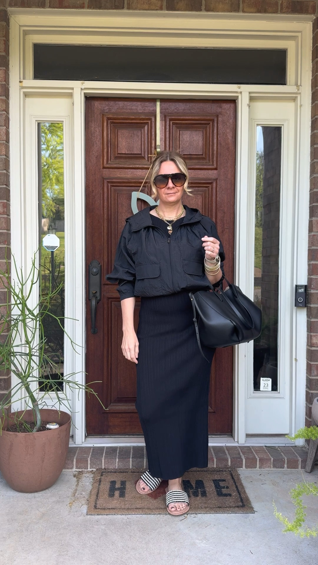 Here are 3 ways to make an all-black outfit look intentional instead of boring 👇

🖤Mix your textures. All black only falls flat when every piece has the same finish and weight. A ribbed midi dress paired with a nylon windbreaker and a beaded slide sandal gives the eye something to move through — same color palette, completely different surfaces. Texture is what makes monochromatic dressing feel deliberate instead of default.

🖤Add one unexpected layer. A windbreaker over a dress, a blazer over a bodysuit, a denim jacket over a slip skirt — an unexpected layering piece breaks up the silhouette and adds dimension without introducing a new color. It takes an outfit from "I'm wearing all black" to "I styled an all black outfit."

🖤Let your accessories do the talking. A jewelry stack, a beaded sandal, a great bag — when your outfit is one color, your accessories become the whole story. You don't need much, just one or two details that signal you got dressed with intention.

OOTD for a day of errands and client shopping ✨ Black ribbed midi dress + black windbreaker + Jack Rogers black and ivory beaded slide + bracelet stack + necklace stack + black tote. Most of these pieces are still shoppable — linked everything below! 👇

#LTKdayinmylife #LTKOver40 #LTKootd