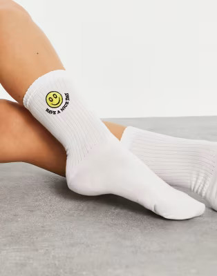 ASOS DESIGN calf length socks with happy face embroidery in white | ASOS (Global)