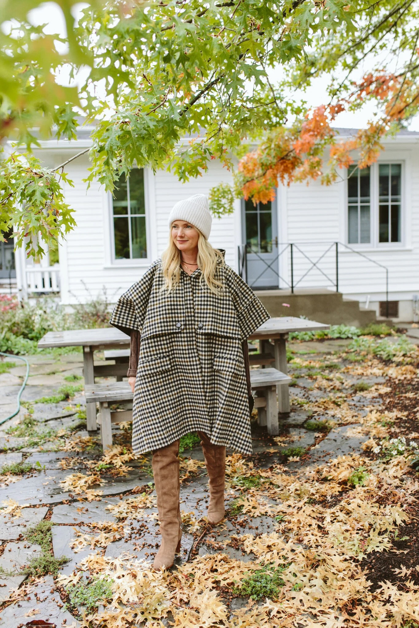 UGH. This cape is ridiculously good. It’s gingham wool, totally timeless, and extremely high quality. It’s a lot of fabric so for me, I’d wear it more with heels than sneakers, but I might make up a work lunch or trip to NYC with someone just to wear it.

It’s splurgy but I feel like it’s one of those pieces that will be in FOREVER. It makes such a statement in a really classic way. The details are so good. And those are my favorite over-the-knee boots (they come in blue suede which I secretly wish I had bought instead, but the brown suede is probably more classic). And this new chunky beanie that I proceeded to lose out of my pocket on a pitch-black nighttime walk with the pups (I’ve already repurchased because the chunkiness is so good).

#LTKshoecrush #LTKstyletip #LTKSeasonal