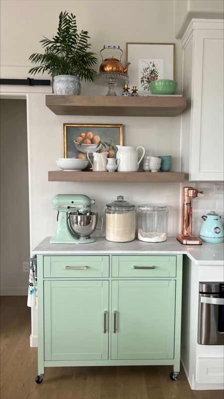 Jade mint green kitchen island bar cart with faux marble counter for extra storage and baking station in my kitchen! Pottery Barn floating shelves for more storage and pretty display for home decor and plates, bowls and art  

#LTKfamily #LTKhome
