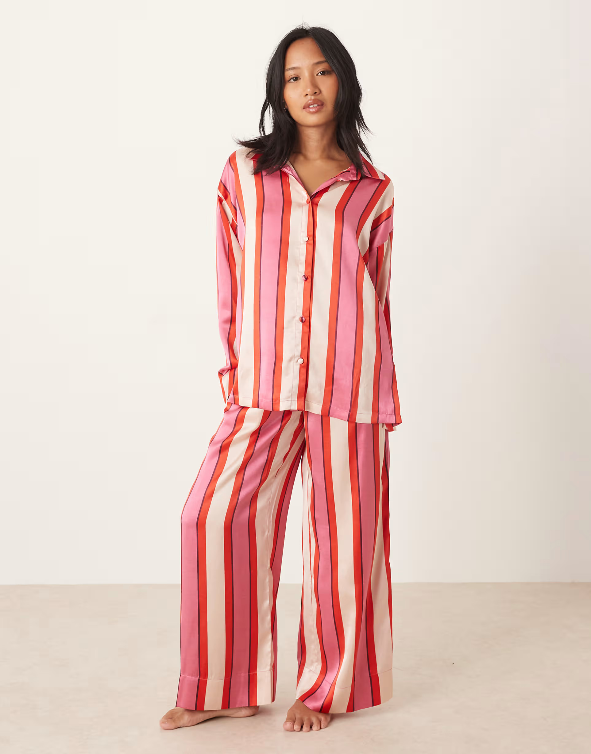 ASOS DESIGN Petite oversized satin shirt and pants pajama set in red & pink stripe | ASOS | ASOS (Global)