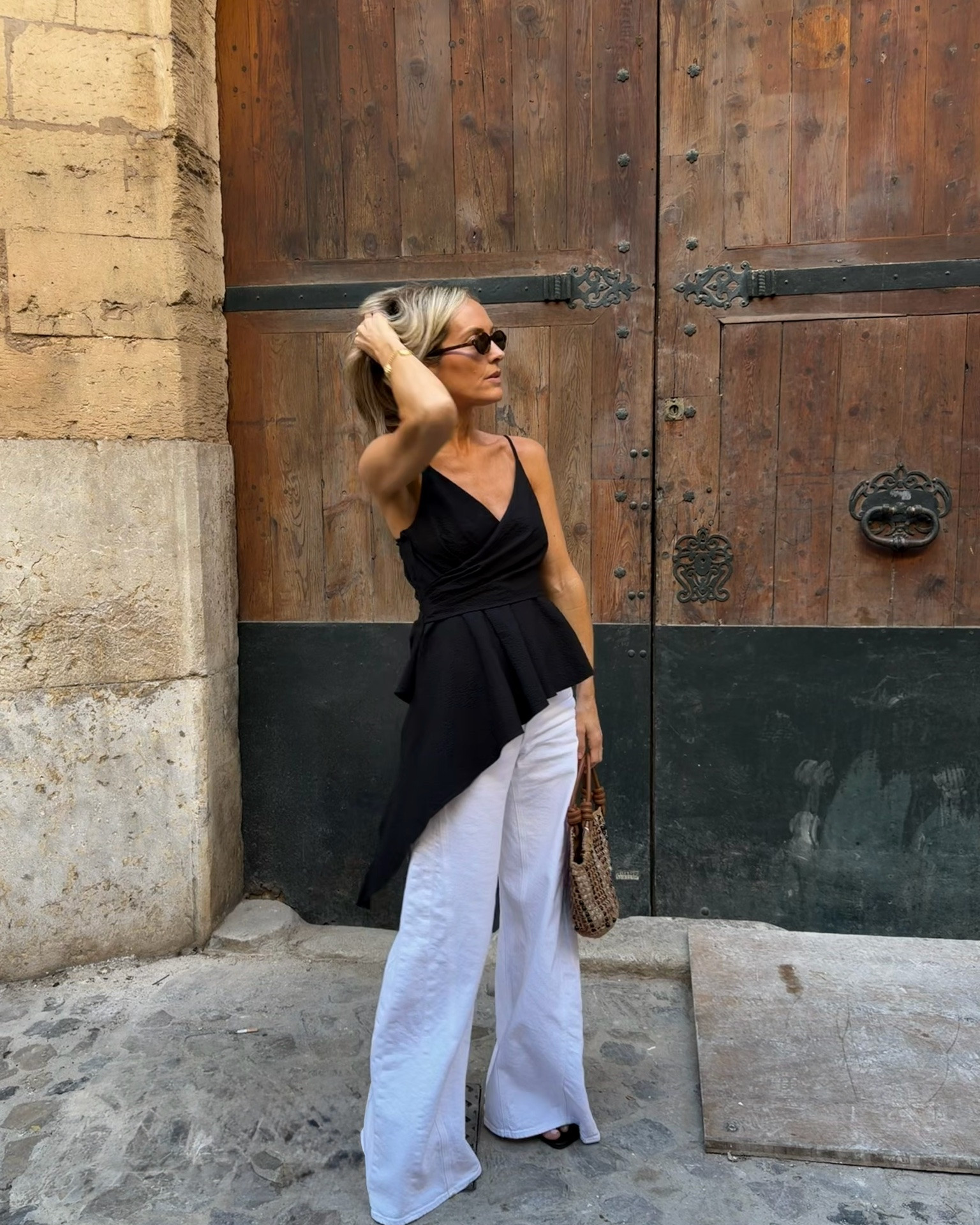 Summer evening essentials - sculptural top, white wide leg jeans, rope detail sandals and a beaded bag 🖤🤎🤍

#LTKuk #LTKsummer #LTKeurope