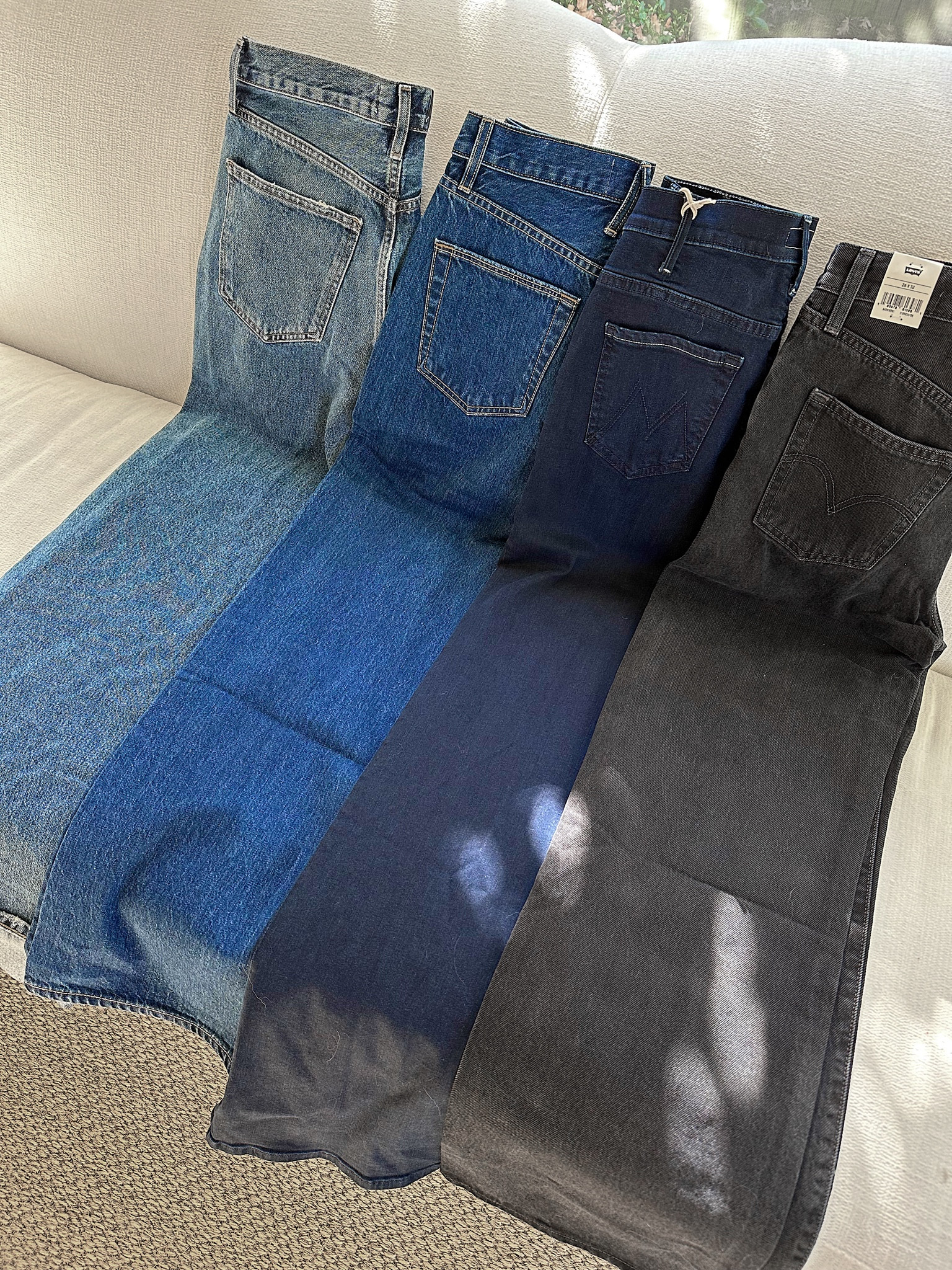 Wide leg denim haul 👖

Left to right:
* AGOLDE Dame—Statement wide leg jean. Very wide opening. Run large and a little long. I take 25 when not pregnant.
* SLVRLAKE Grace Wide Leg (color Evermore)—Rigid mid-wash. Run small. Size up if unsure. I take 25 when not pregnant.
* MOTHER Hustler Roller Sneak (color Karaoke in Kyoto)—Stretchy and comfortable. TTS. I take 25 when not pregnant.
* Levi’s Ribcage Wide—LOVE the fit of these. Highly recommend! Great for everyday wear, not too wide. Go with many shoe types. I take size 25 when not pregnant.

#widelegjeans #jeans #jeanswideleg

#LTKSeasonal