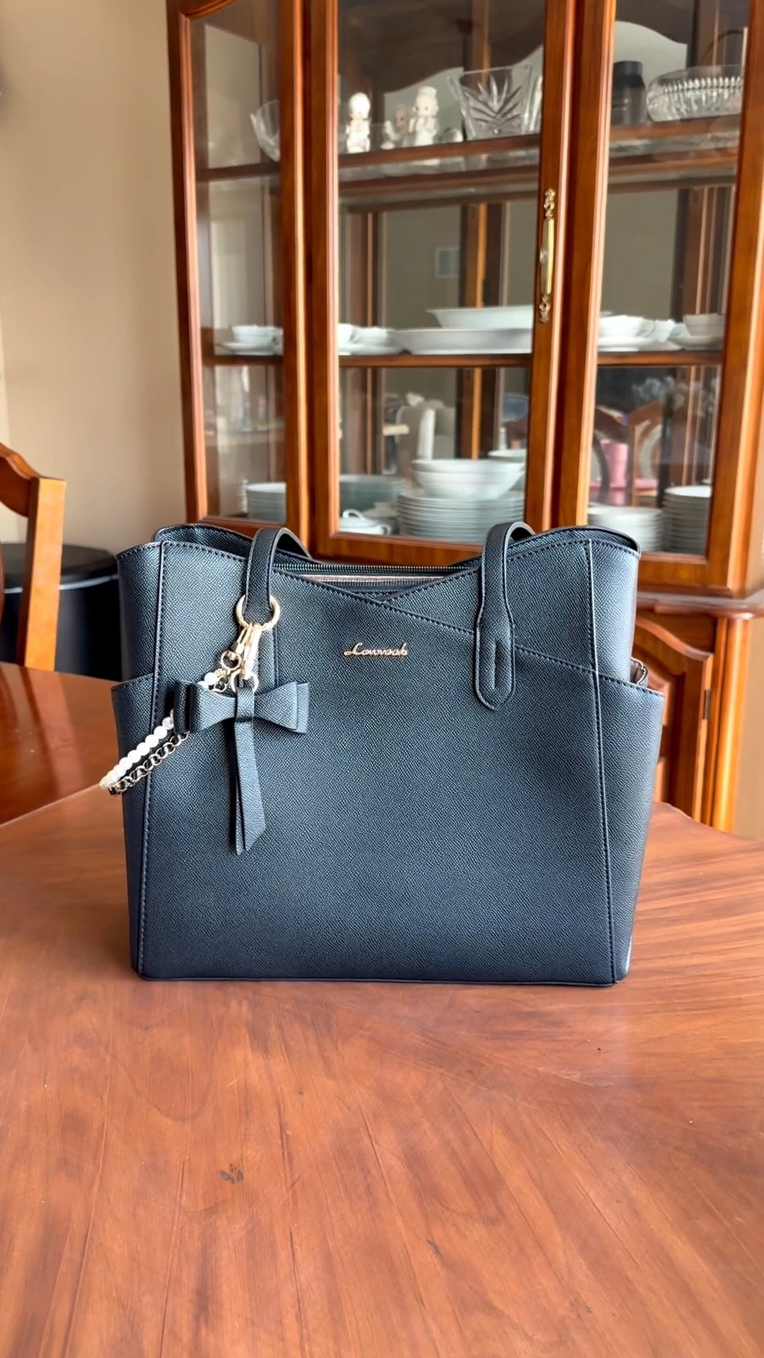 I love adding accessories to make my bags have a little extra “oomph” Check out this cute little bag chain!