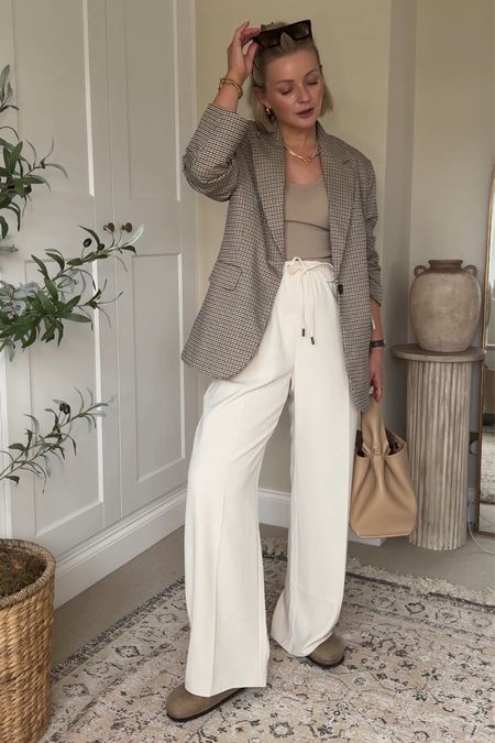 Spring outfit ideas. Cream wide leg trousers (size 10), check blazer, Birkenstock bostons  