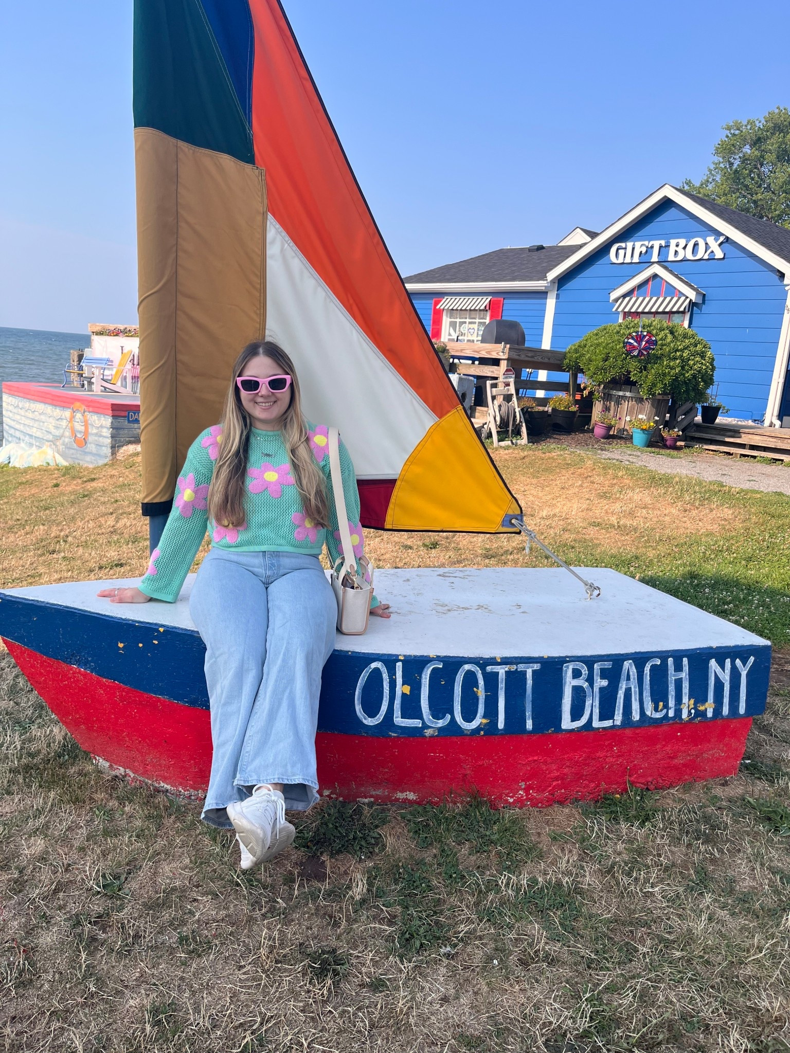 ☀️ Lake day style at Olcott Beach, NY 🌊 This colorful summer outfit with a retro floral sweater, wide leg jeans, and white sneakers is giving all the lake town fashion and coastal casual vibes. Add in my favorite pink sunglasses + neutral tote bag and you’ve got the perfect weekend getaway outfit for a lake trip, beach walk, or casual vacation day. 🌸🕶️

This look is a mix of retro inspired fashion, fun statement pieces, and comfortable casual outfits for travel. Perfect for early fall transition style, a cool summer night at the lake, or even road trip outfit inspo.

Shop this affordable colorful outfit, lake day fashion must-haves, and vacation capsule wardrobe staples right here on LTK! 🚤💙

#LTKMidsize #LTKFindsUnder50 #LTKSeasonal