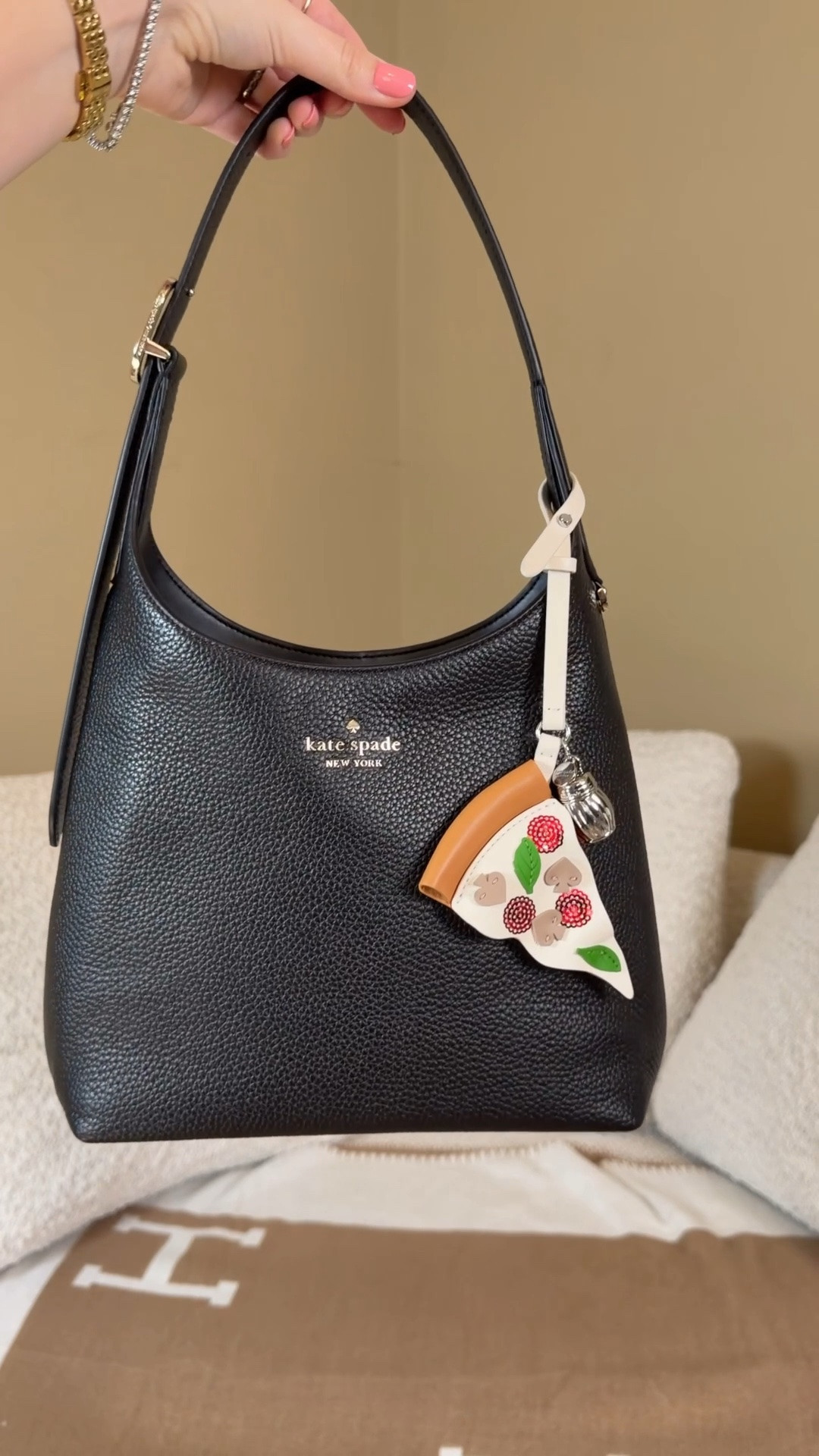 After seeing the viral Kendall Jenner Kate spade mini duo picture, I ran to a Kate Spade Outlet to see what they had and it did not disappoint!

As soon as I walked in the 454 shoulder bags stood out to me! They look just like the Coach Brooklyn. I had to grab one to compare and at that price point, they are a great affordable alternative for the Coach Brooklyn. I got it in black to see how much I would carry a black Brooklyn if I got one and I’ve been loving it so may have to splurge on the Brooklyn.

The small 454 shoulder bag has pebbled leather which is really different from most of my bags and I love how neutral the hardware is, somewhere between gold and silver. I also like that the strap is adjustable and just like the Coach Brooklyn, it has a little loop for bag charms 💗

Of course the pizza bag charm had to come home with me too 😉

Kate spade outlet
Kendall Jenner style