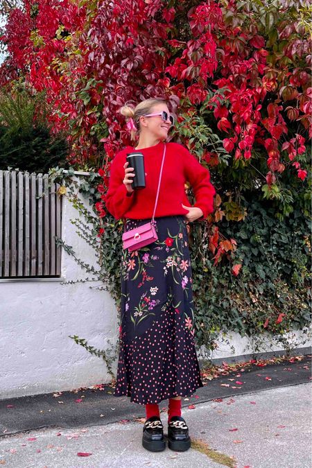 Red Floral. Fashion Blogger Girl by Style Blog Heartfelt Hunt. Girl with blond hair wearing a pink hair clip, red sweater, red floral dress, pink sunglasses, pink mini bag, red socks and chunky loafers. #floraldress #chunkyloafers #colorfuloutfit #colorfulstyle #colorfulfashion #colorfullooks #fashionfun #cutefalloutfit #fallfashion2023 #falllookbook #fitcheck #dailylooks #dailylookbook #contentcreator #microinfluencer #discoverunder20k
